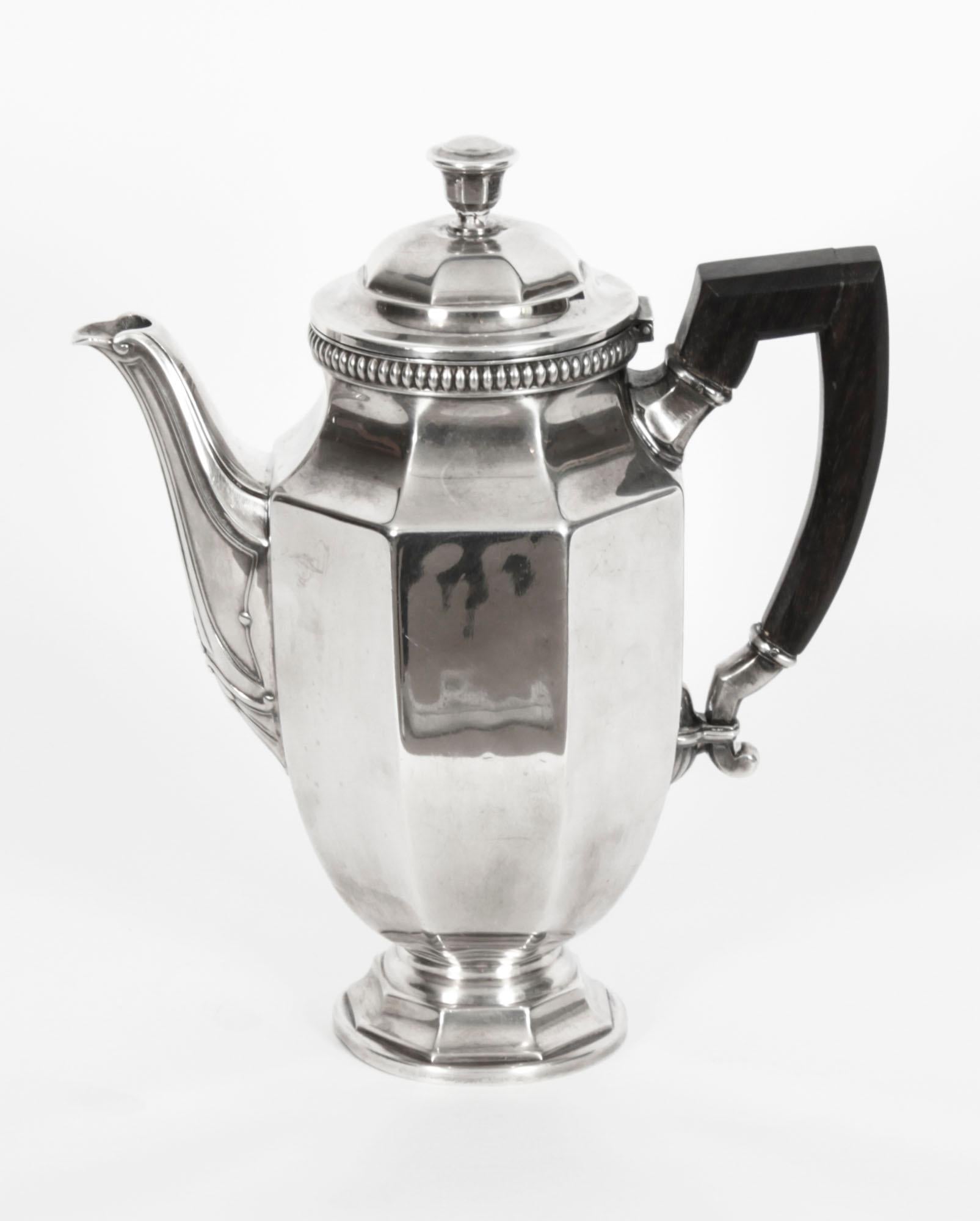 Antique Art Deco French Christofle Colbert Gallia silver plate tea & coffee 4 piece set, circa 1920's.

The set includes stylish coffee and tea pots with a lidded sugar pot and a milk jug.

They feature octagon shaped bodies with shaped hardwood