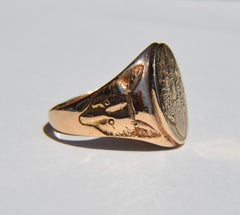 Antique Art Deco, circa 1934 10 Karat Gold Fox and Goddess Signet Ring