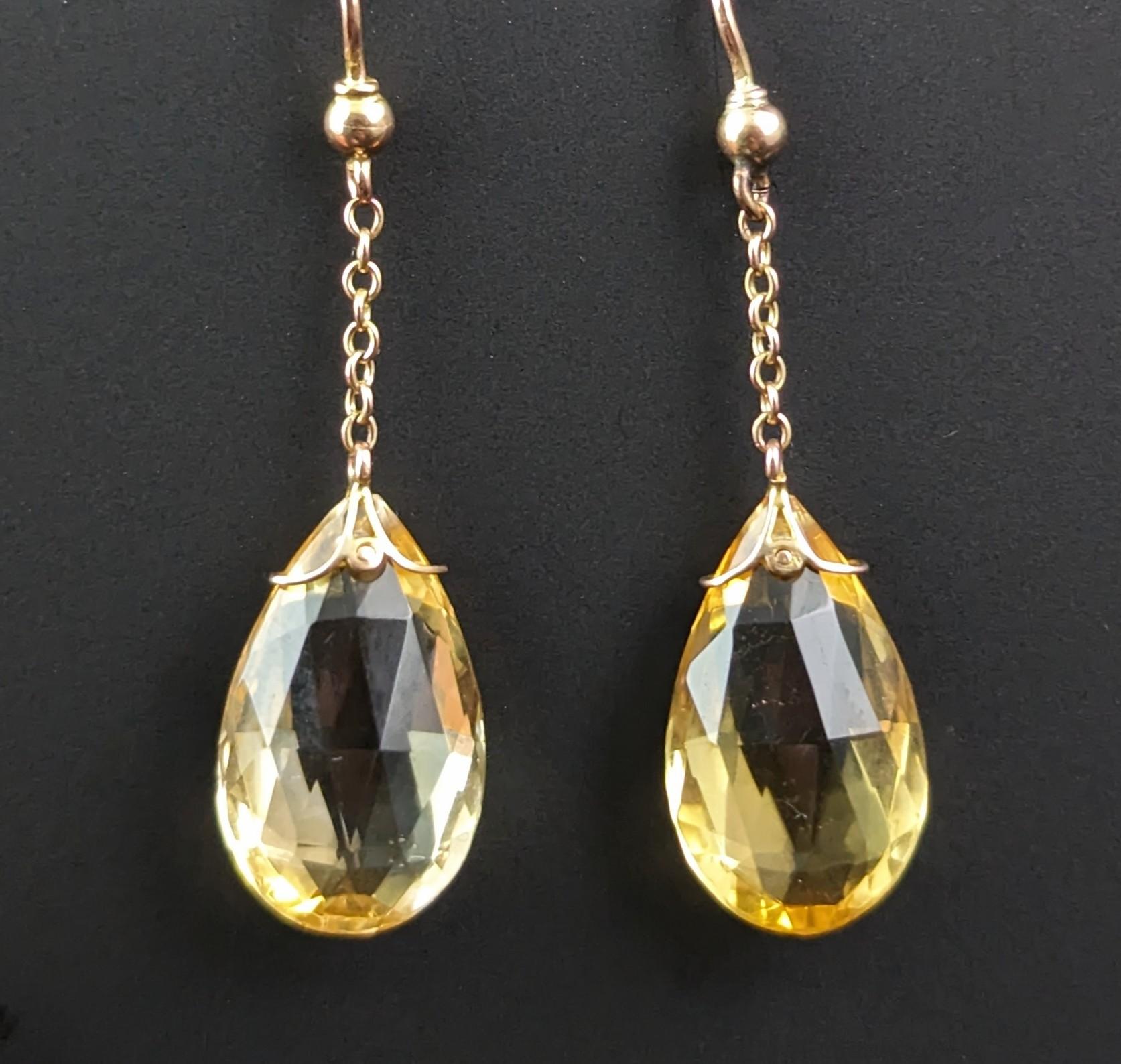 You can't go wrong with this gorgeous pair of antique Art Deco era Citrine drop earrings.

Beautifully faceted,teardrop shaped, Briolette citrine drops give a touch of feminine sunshine to any outfit, the cut gives just the right amount of warm