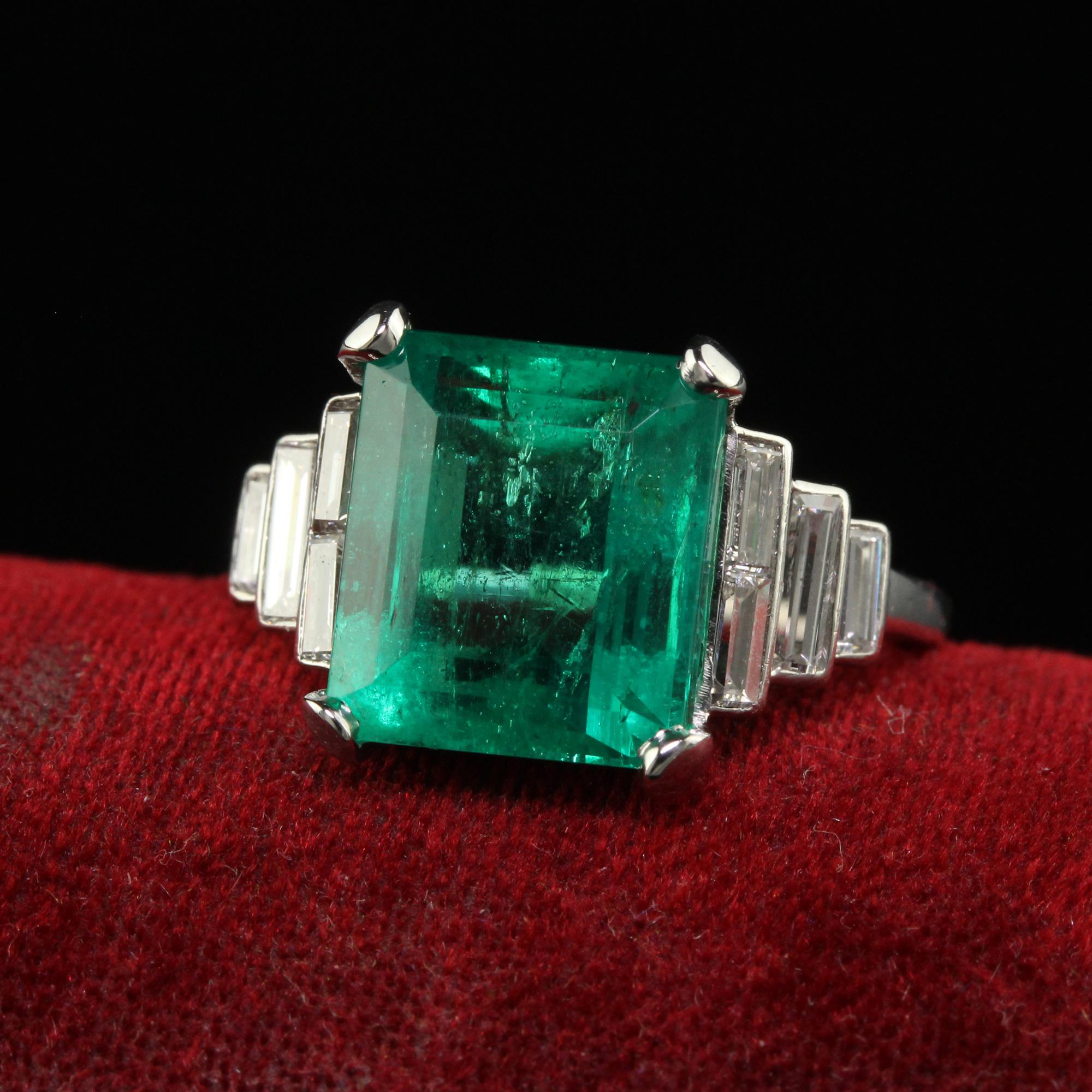 Beautiful Antique Art Deco Colombian Natural Emerald and Baguette Diamond Ring - GIA. This incredible Art Deco emerald and diamond ring is crafted in platinum. This features a gorgeous natural Colombian green emerald in the center that has a GIA