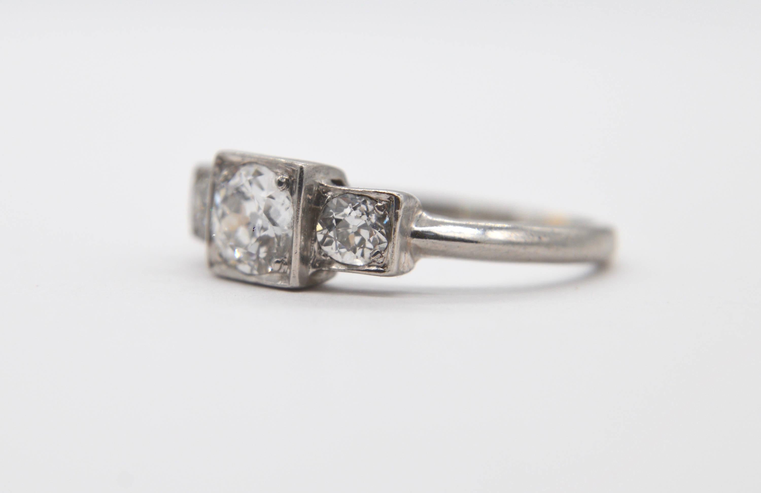 Beautiful antique Art Deco era circa 1920s .50 carat center stone, with two .11 ctw each side stones Transitional cut diamond platinum step engagement ring. Size 5.25, can be resized by a jeweler. The diamonds have been graded by a jeweler as color