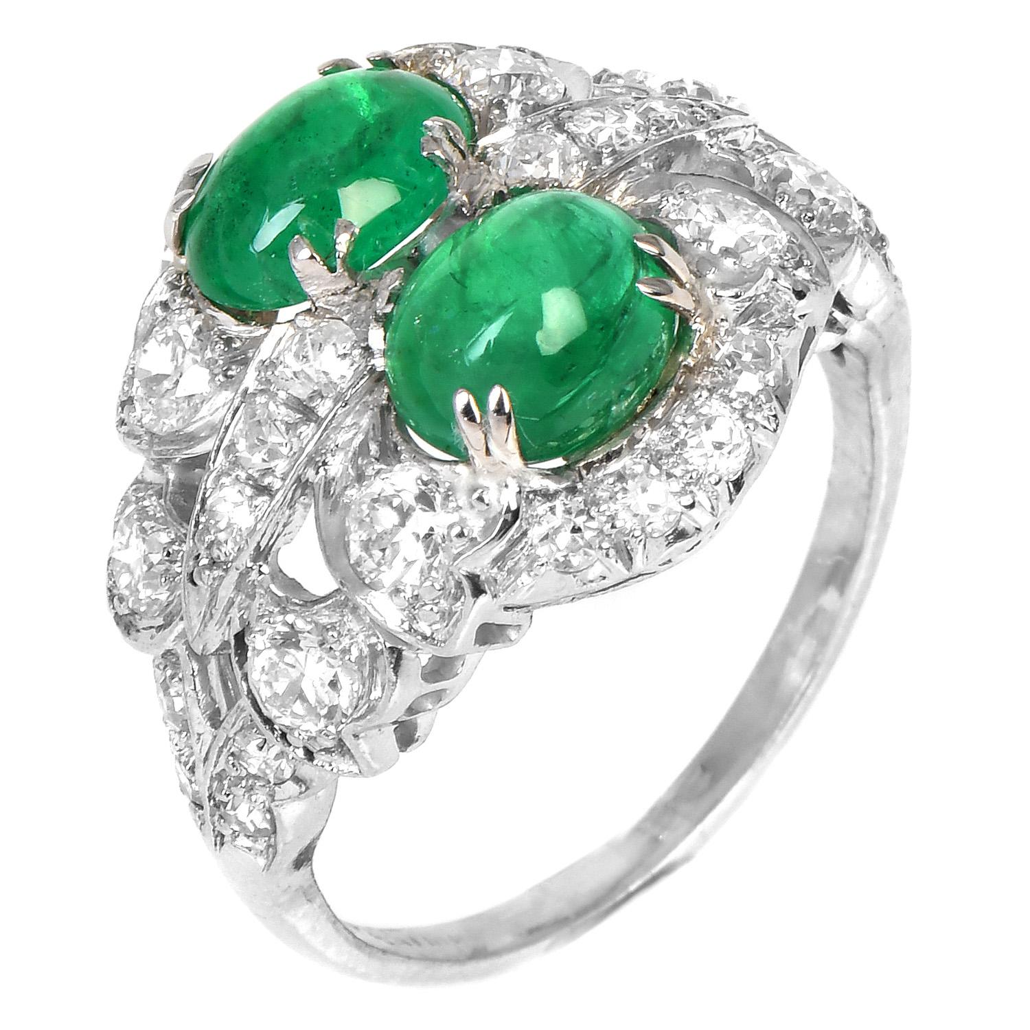 This one-of-a-kind Double emerald, floral-inspired art dego ring, is the perfect compliment for your emerald jewelry collection.

With gorgeous old cut hight quality diamonds, adorning the luxurious platinum crafted piece.

It is centered with (2)