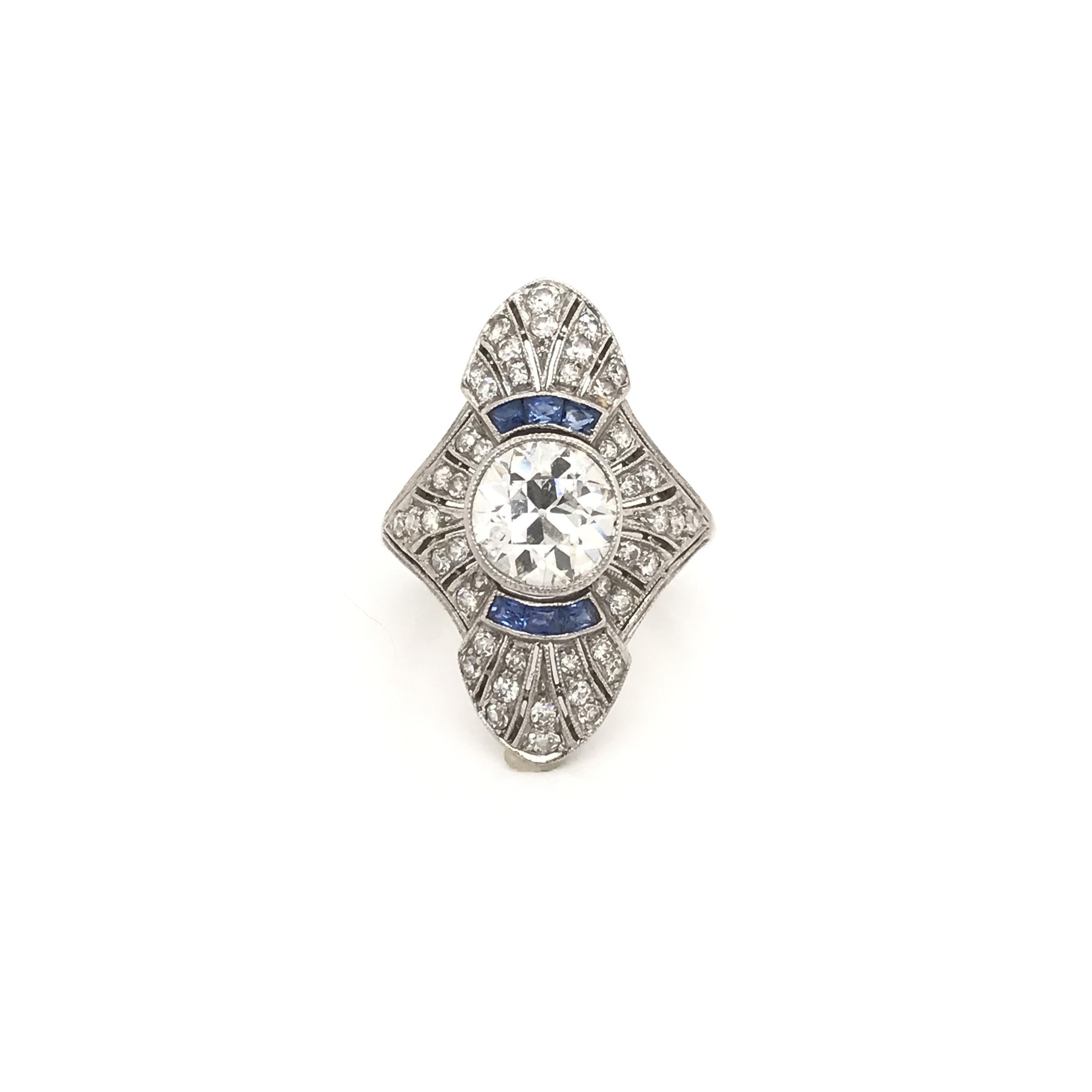 This exquisite antique piece was crafted sometime during the Art Deco design period (1920-1940). The platinum filigree setting features an antique Old European cut center diamond measuring approximately 1.60 carats. The diamond grades approximately