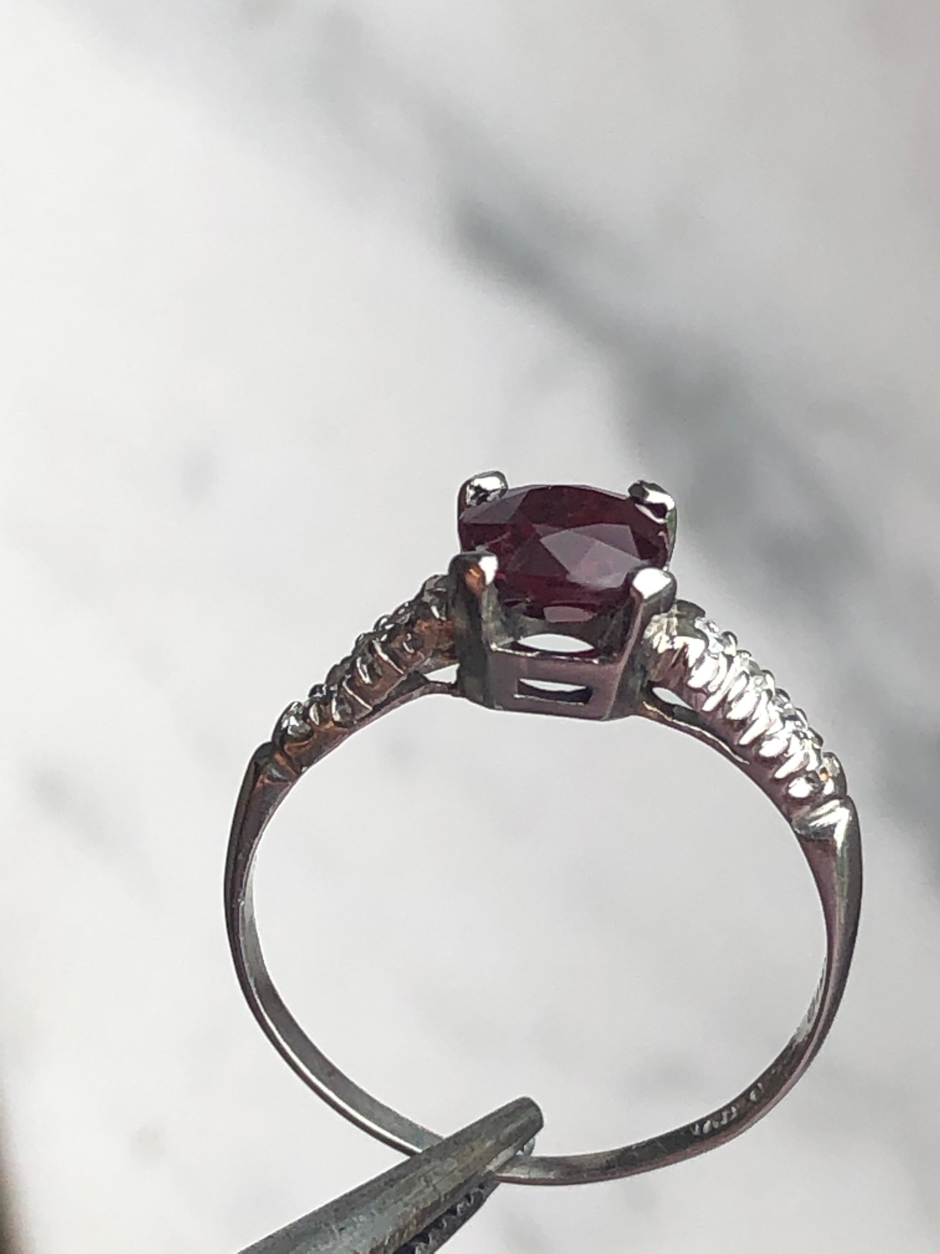 Antique Art Deco Diamond and Ruby Platinum ring
Ruby and diamond dainty ring. antique cushion cut center ruby with six round side diamonds in a platinum dainty setting.  Approx. 1.10 carats total weight.
Size: 6.25 and Stamped: 100% platinum 1.5