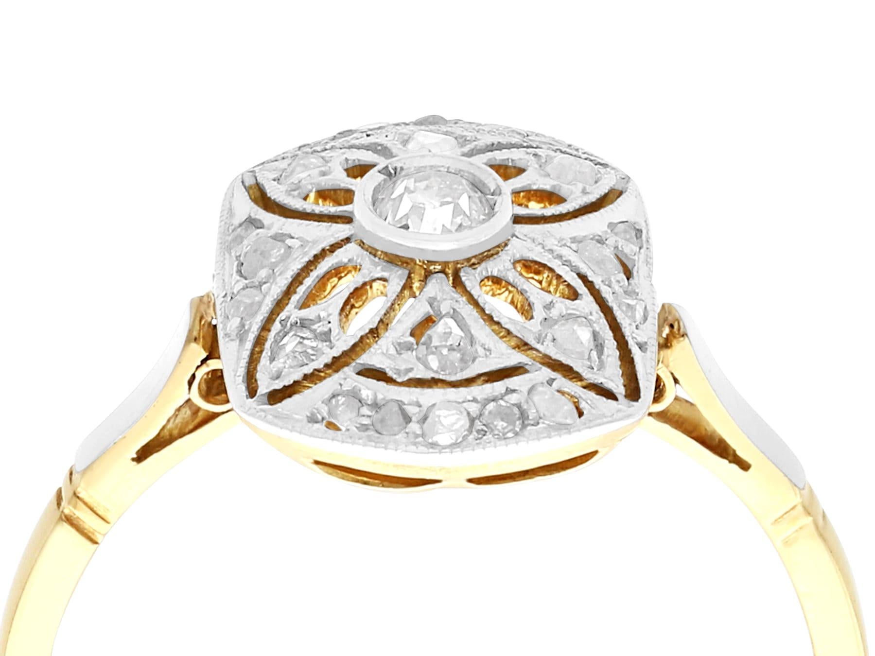 An impressive antique 1930's Art Deco 0.25 carat diamond and 18 karat yellow gold, platinum set dress ring; part of our diverse antique estate jewelry collections.

This fine and impressive Art Deco diamond ring has been crafted in 18k yellow gold