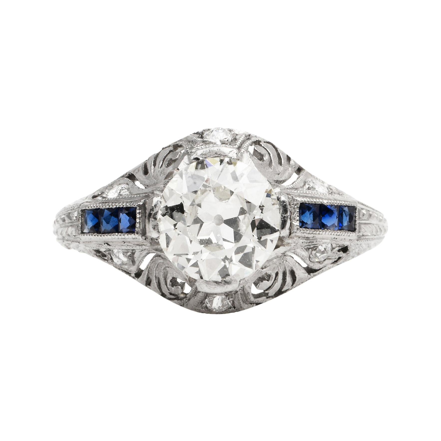 Fine Art Deco Engagement ring, with a high-quality center-diamond surrounded by handmade filigree design,

Crafted in solid Platinum, the center is adorned by (1) Old Cut, prong-set, genuine diamonds weighing in total 1.00 carats, ( I-J color and VS