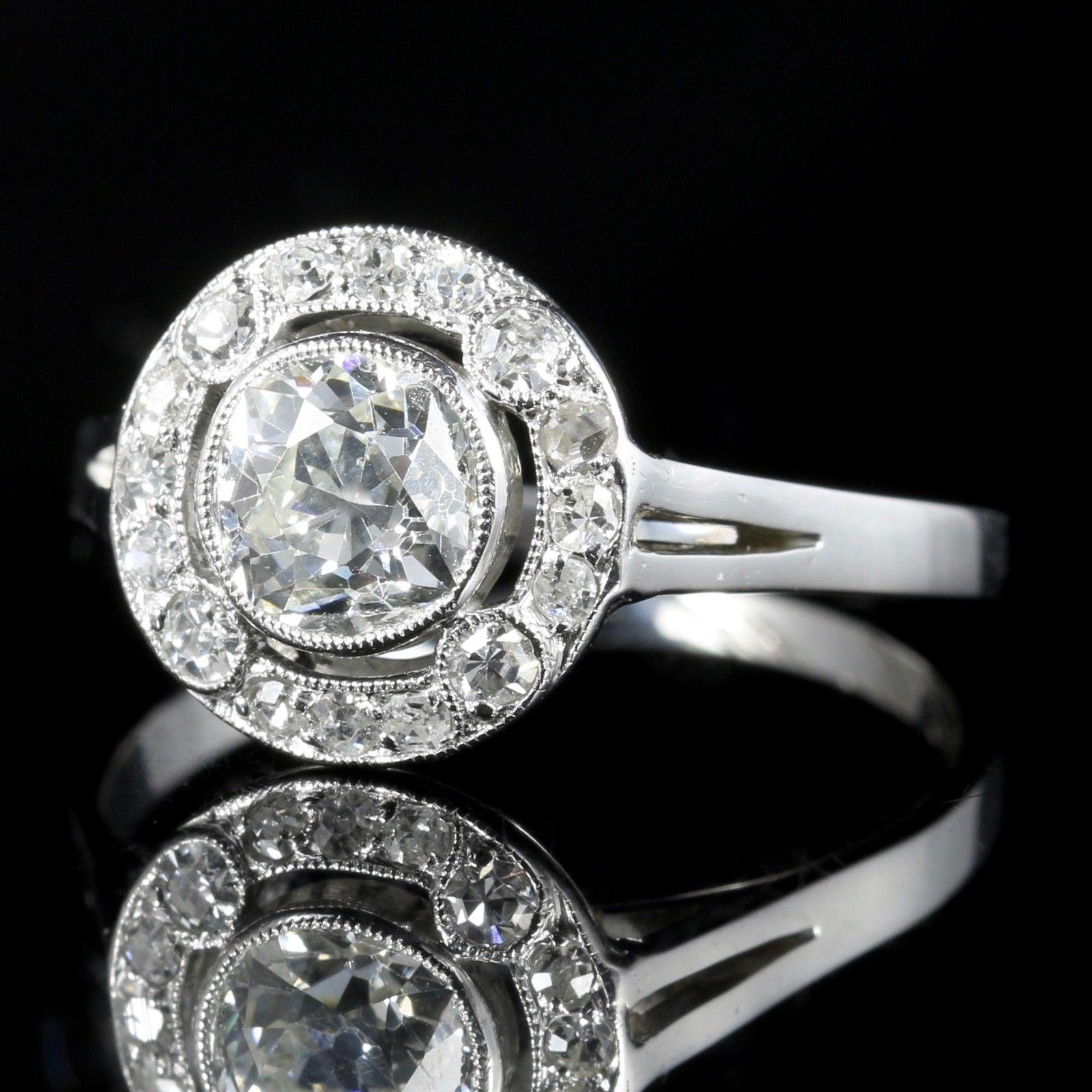For more details please click continue reading down below...

This amazing Antique Art Deco all Platinum Diamond ring is stunning.

Circa 1920

Set with a central 1ct old cut Diamond surrounded by a halo of old cut Diamonds. 1.50ct in total