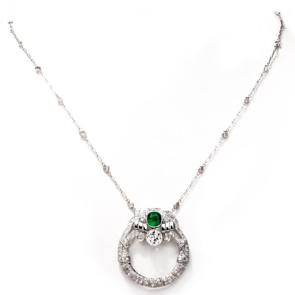This antique circa 1925 pendant necklace with an integrated diamond adorned chain, is handcrafted in solid platinum. The circular plaque sparkles with a prominent old European-cut diamond approx. 1.50 carats, I color, VS2 clarity set within a finely
