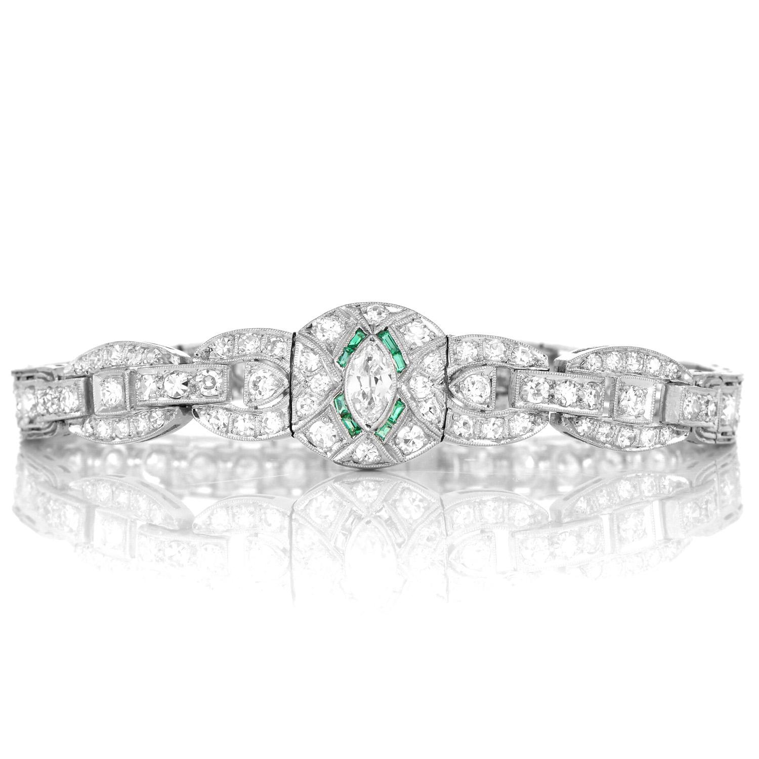 This Antique 1930s Rounded Geometric inspired Diamond and Emerald Bracelet was crafted in luxurious Platinum. 

The bracelet is covered in Diamonds from one end to the other, featuring an Emerald accented center.

Intricate open link design with a