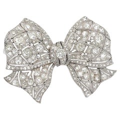 Antiguo broche Art-Deco de diamantes talla antigua de platino con lazo
