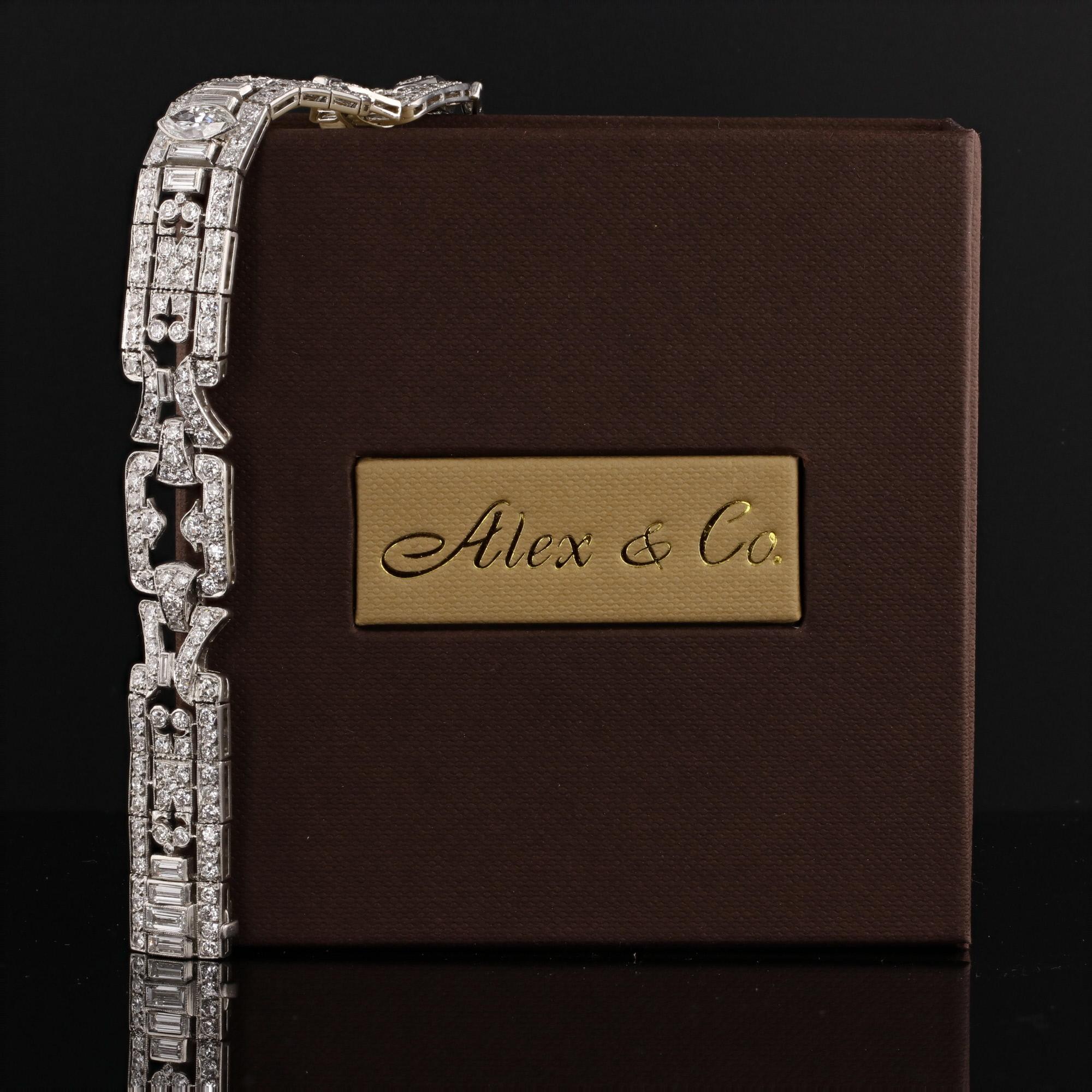 This exquisite handmade antique art deco era 1930's diamond platinum bracelet is offered by Alex & Co. The luxurious bracelet at the center features a bezel set marquise diamond weighing approximately 0.96ct G color and SI1 clarity. There are 13