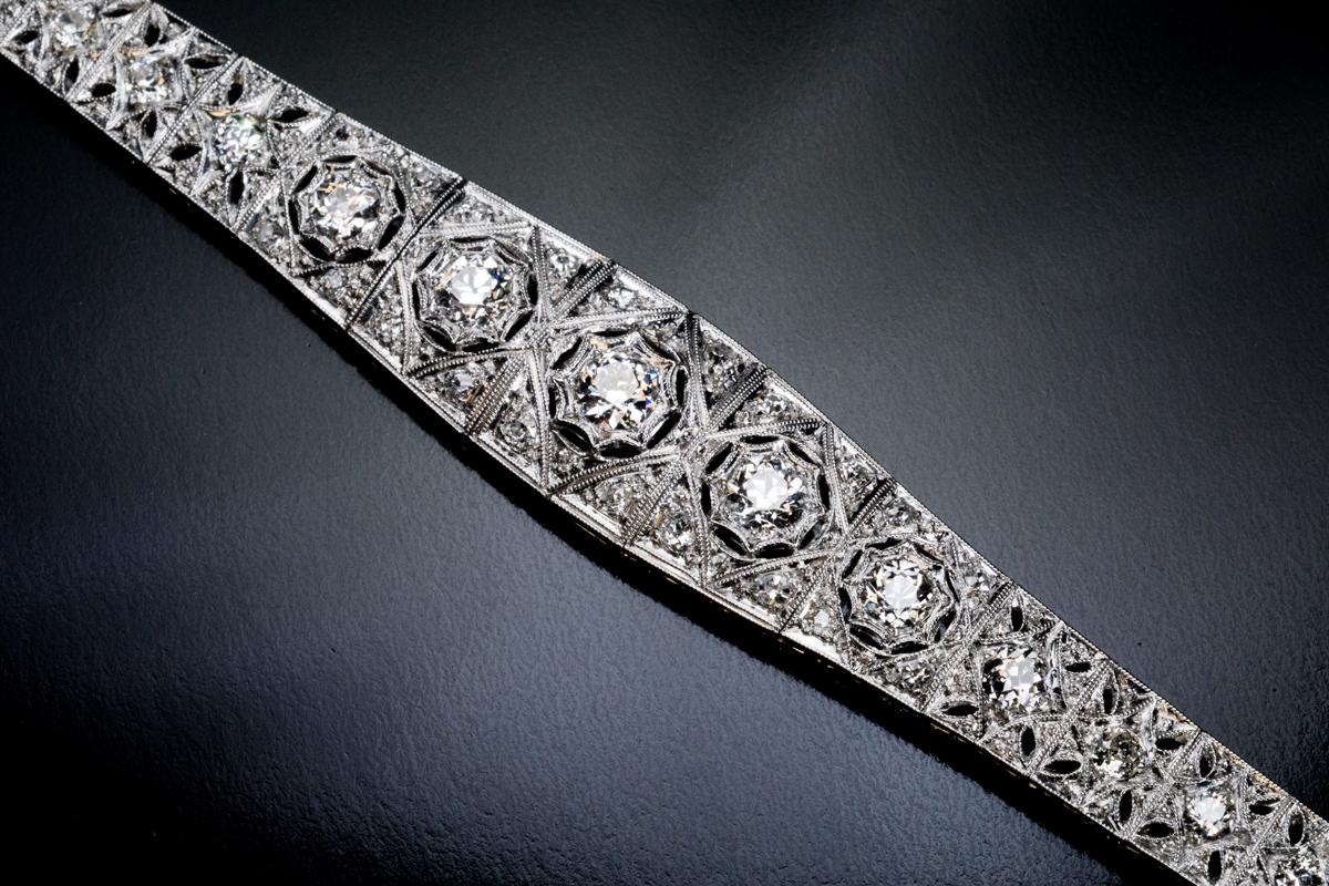 Early Art Deco, c. 1910s
This very well made star motif platinum openwork bracelet is embellished with bright white old European and old mine cut diamonds (G-H color, SI1-SI2 clarity).
Estimated total diamond weight is 3.70 carats.
Length – 179 mm