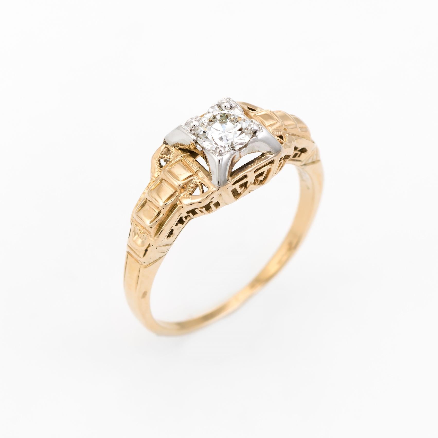 Finely detailed vintage Art Deco era engagement ring (circa 1920s to 1930s), crafted in two tone 14 karat yellow & white gold. 

Centrally mounted estimated 0.33 carat old European cut diamond is estimated at H-I color and VS2 clarity. 

Elegant and