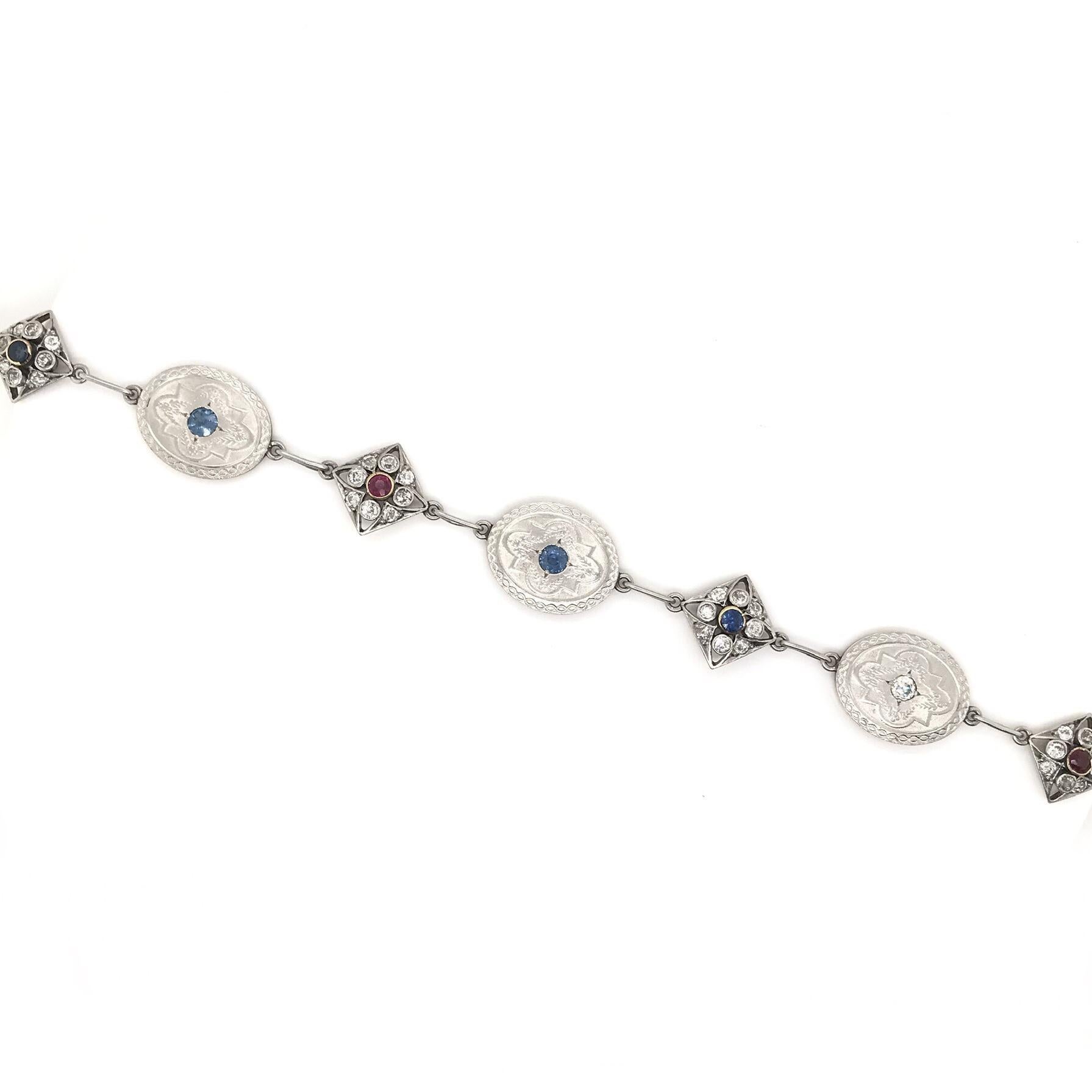 Antique Art Deco Diamond Sapphire and Ruby Charm Bracelet In Excellent Condition In Montgomery, AL