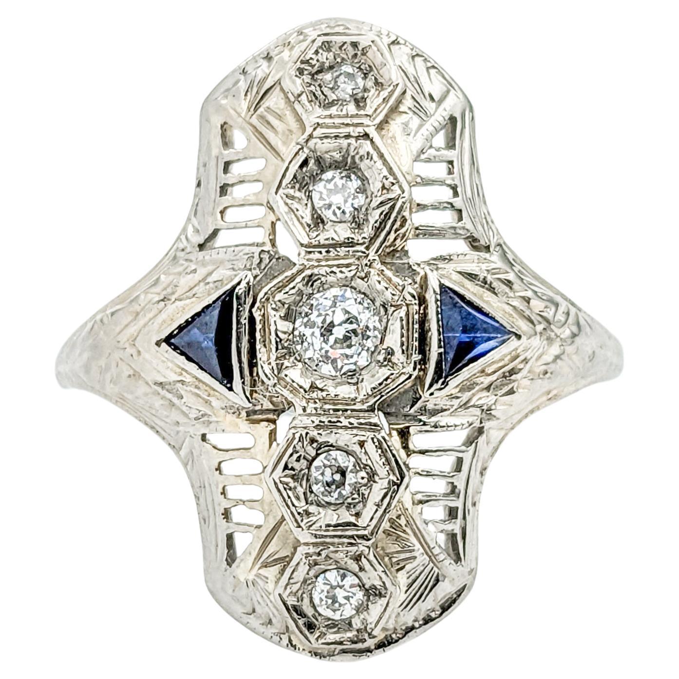 Antique Art Deco Diamond & Sapphire Filigree Shield Ring In White Gold For Sale