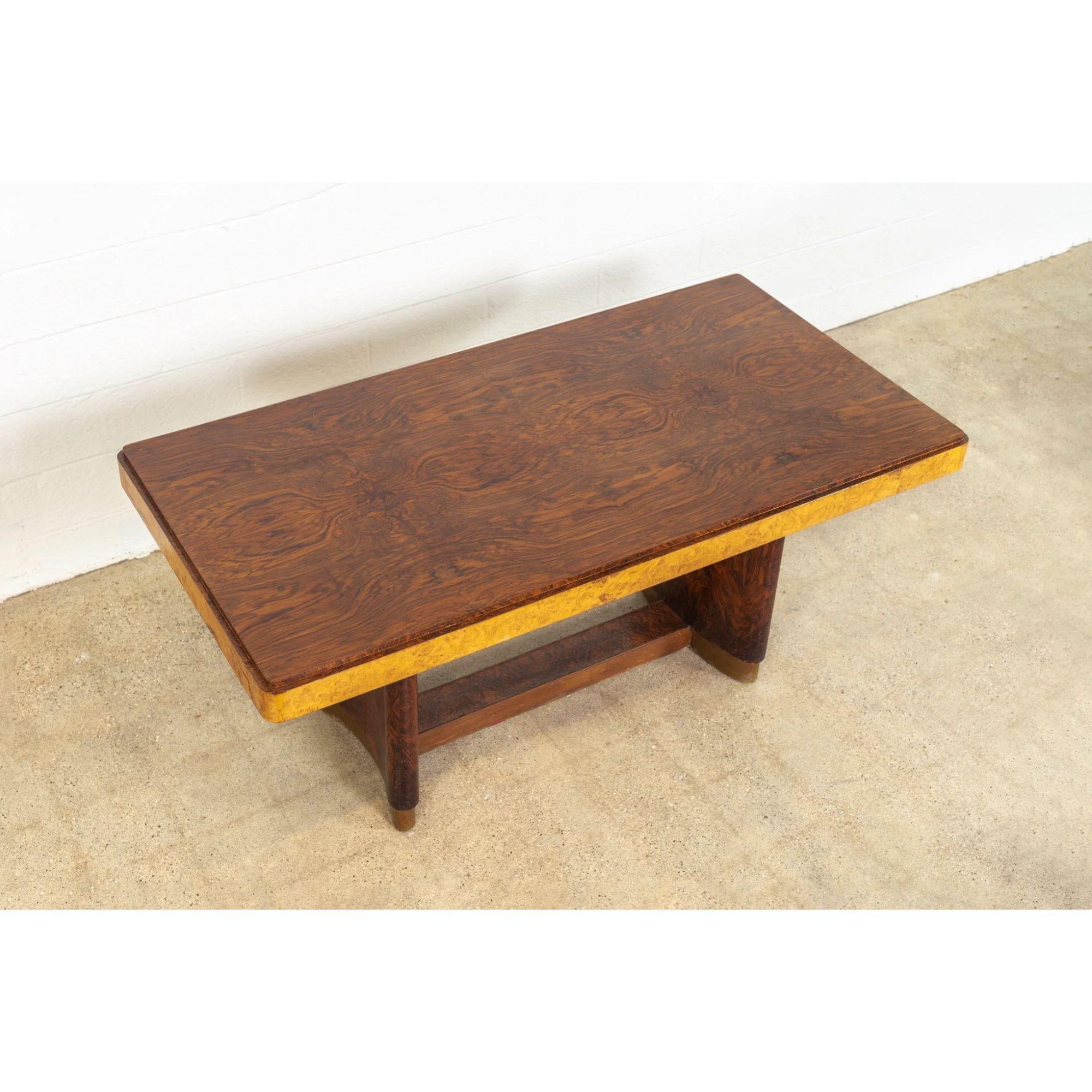 Antique Art Deco Burl Rosewood and Maple Dining Table, 1930s

This exceptional antique Art Deco dining table circa 1930 features a streamlined, unadorned geometric design expertly crafted from rosewood burl wood and birdseye maple with stunning