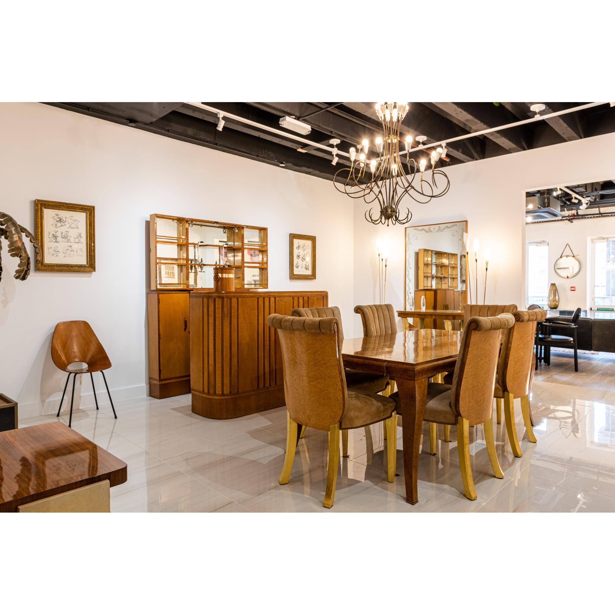 This rare and unique bar comprises of a free standing serving counter and a separate unit which is for display and storage. 

The free standing serving bar has a slight curved shaped front with ridged long lines which adds a lovely subtle decorative