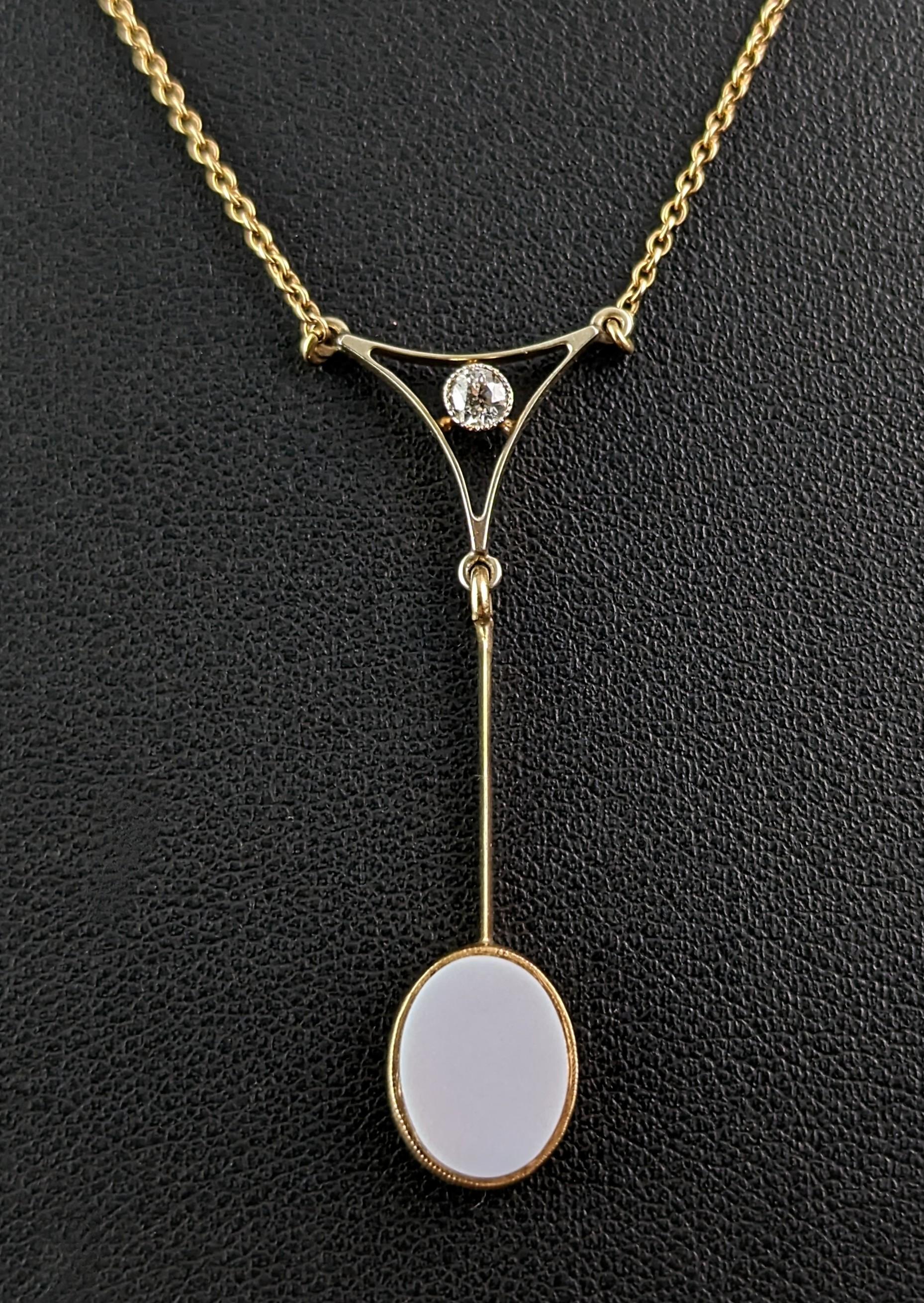 This beautiful Antique Art Deco 9ct yellow gold, Diamond and Sardonyx drop pendant necklace is so feminine and unusual.

The pendant has a single old cut diamond to the top in a fancy geometric style triangle intercepted by a gold bar drop, from