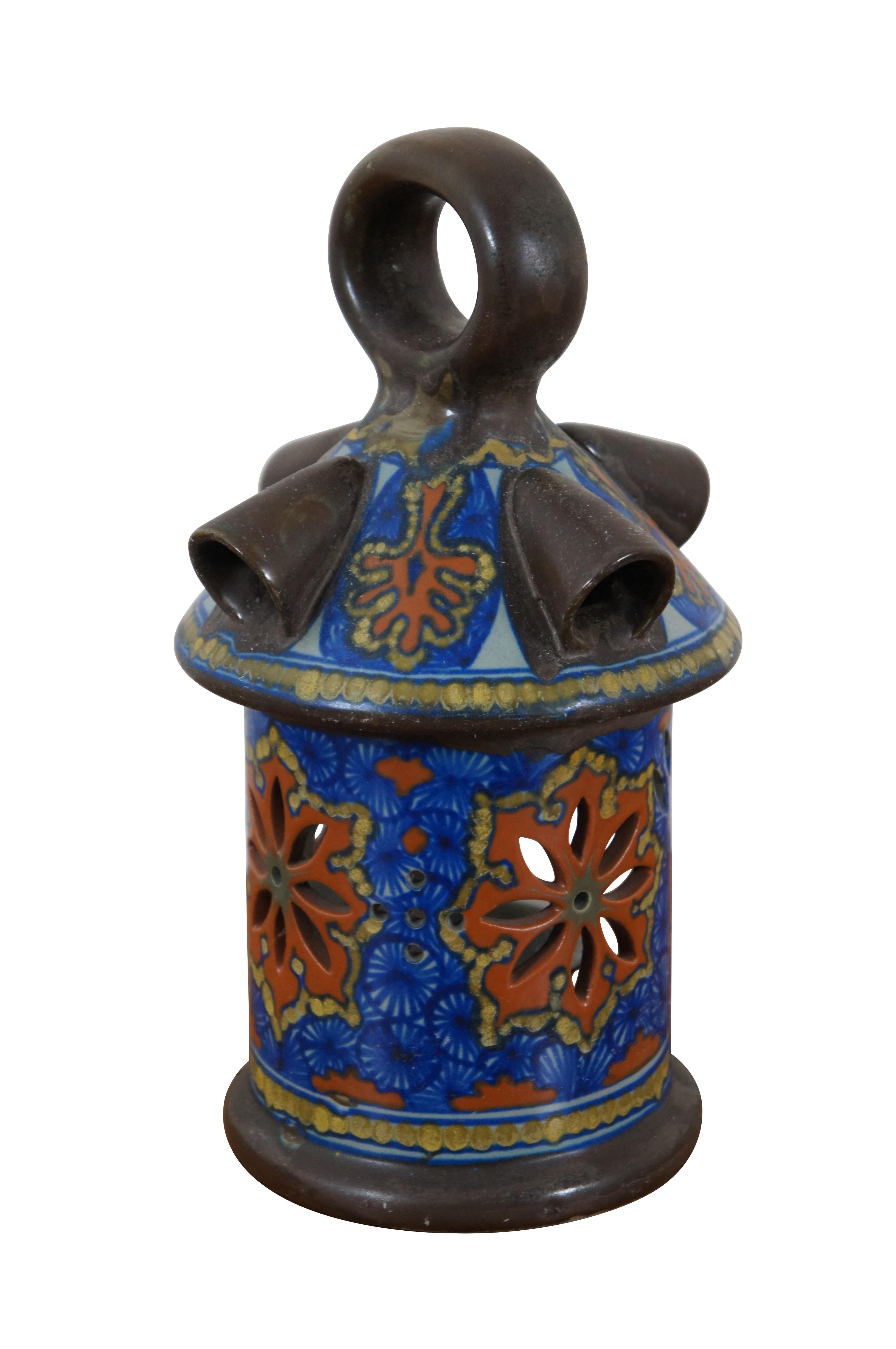 Antique Gouda a Jour Dutch pottery candle lantern, hand painted in brown, blue and orange. Houses a tea light sized votive candle. Made in Holland for Marquise de Sevigne Rouzand.

Dimensions:
5.5