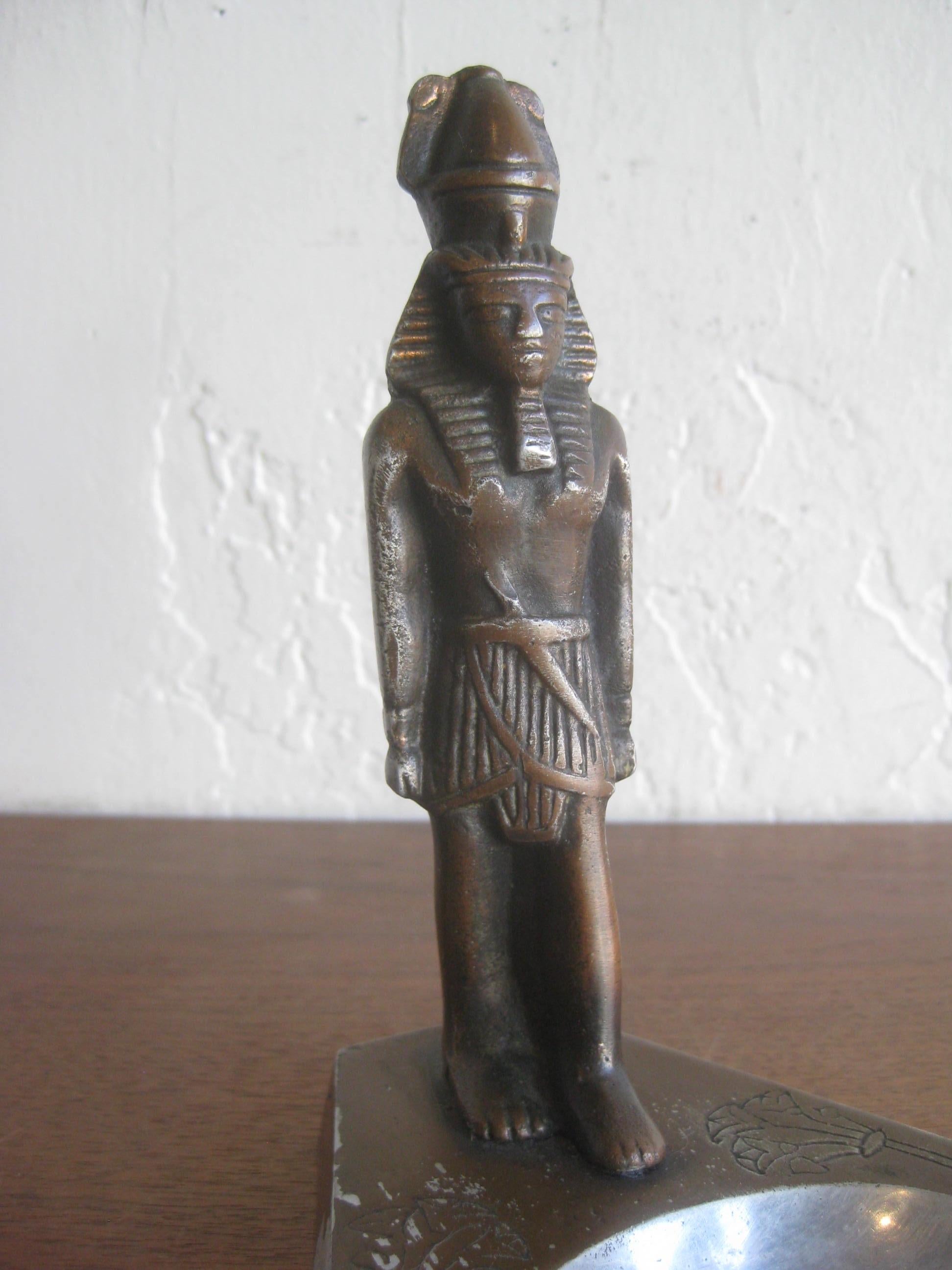 Great Art Deco Egyptian Revival Pharaoh figural statue ashtray dating from the 1930s. Made from cast aluminum and has wonderful details. Still has most of the original brown cold paint on the surface. In very nice original condition with no cracks