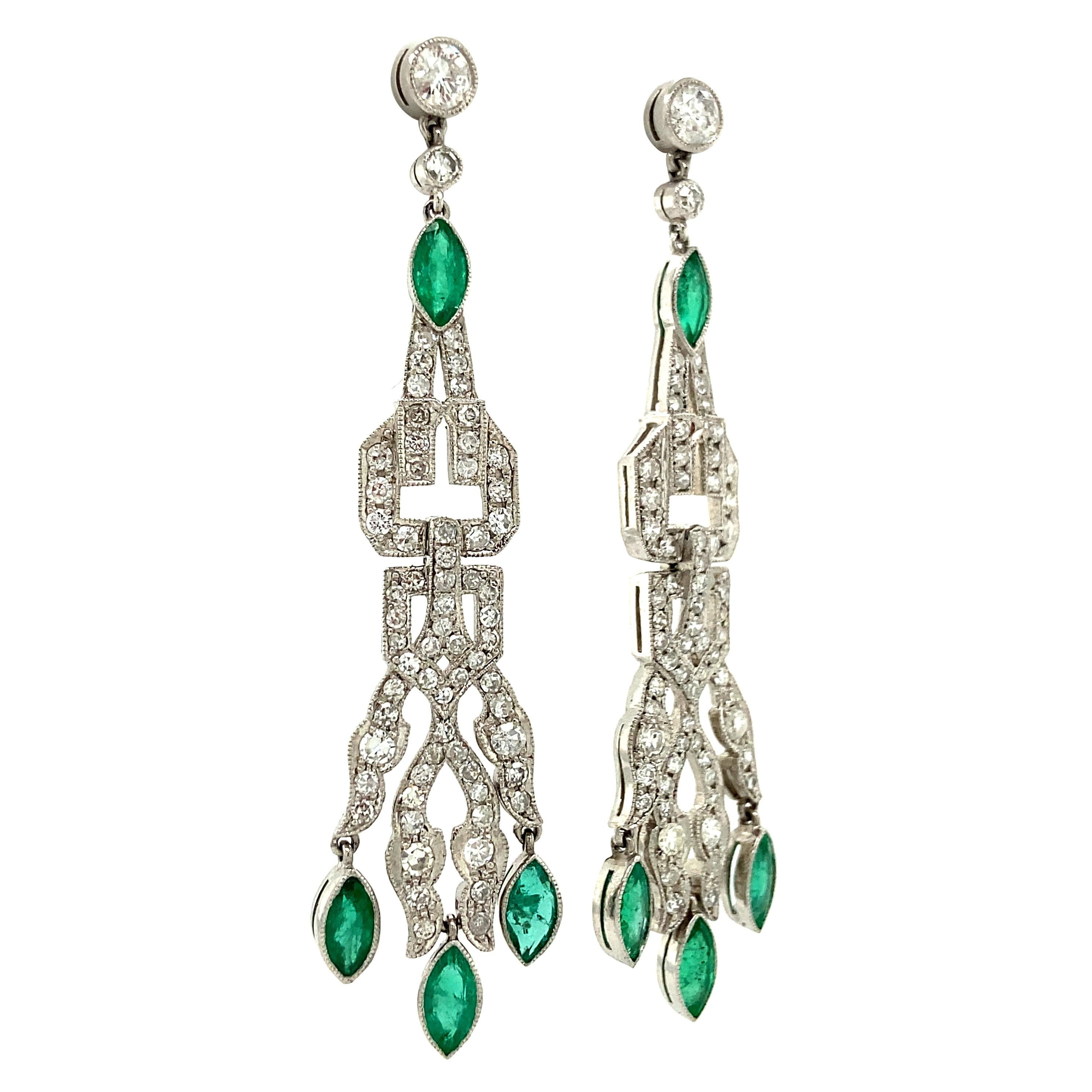 Crafted from precious platinum, these Art Deco earrings were made circa 1925 and feature beautifully matched natural emeralds gleaming among 1.04 carats total of brilliant, sparkling pave-set diamonds. Each section of these earrings is articulated,