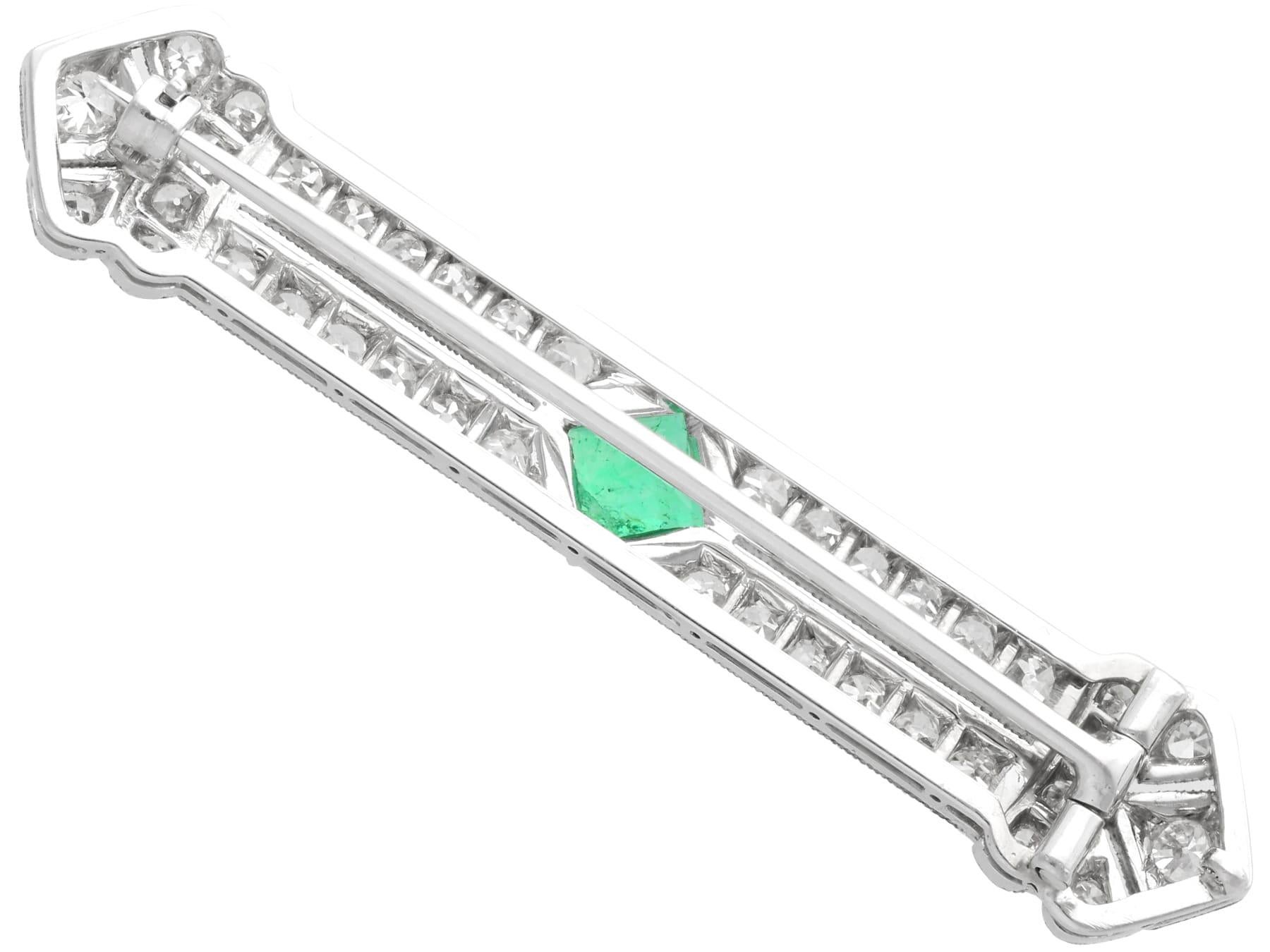 Women's Antique Art Deco Emerald and 1.29 Carat Diamond Platinum Brooch For Sale