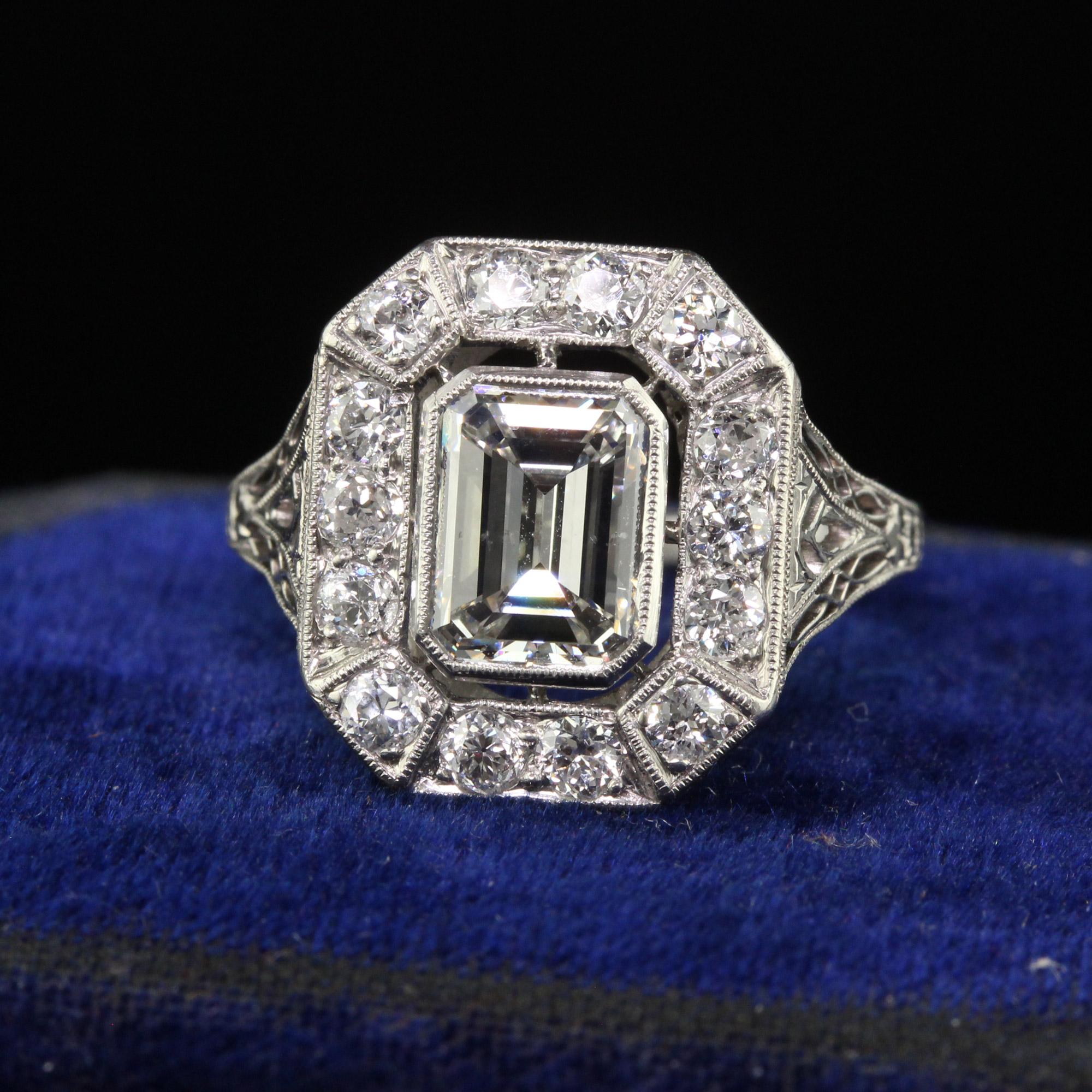 Beautiful Antique Art Deco Emerald Cut Diamond Filigree Engagement Ring - GIA. This gorgeous engagement ring is crafted in platinum. The center holds an old emerald cut diamond that has a GIA report. There are old European cut diamonds surrounding