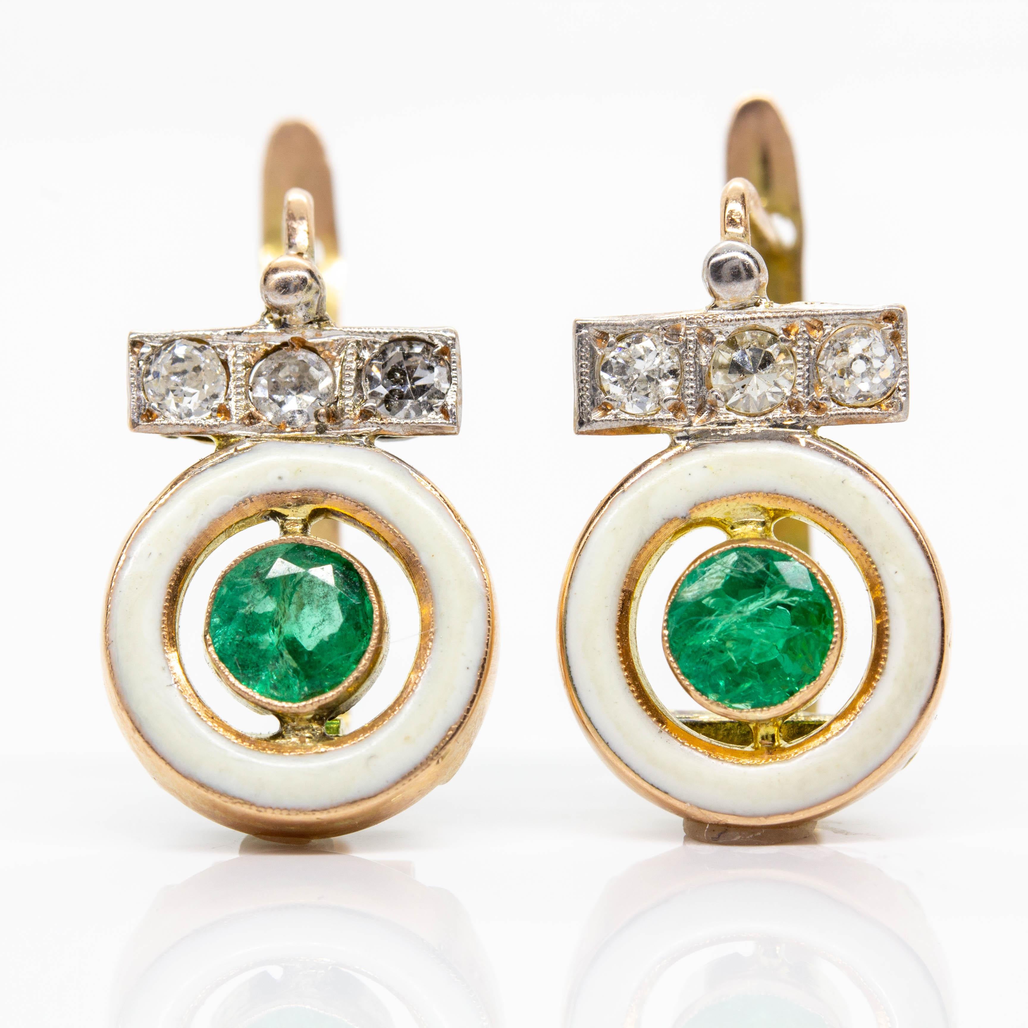 Art Deco Style
Composition: 18k Gold
•	2 natural round cut emeralds 1ctw.
•	6 single cut diamonds I-SI1 0.30ctw.
Earrings measurement: 18mm by 12mm by 5mm
Total weight: 2.5 grams – 1.7dwt

