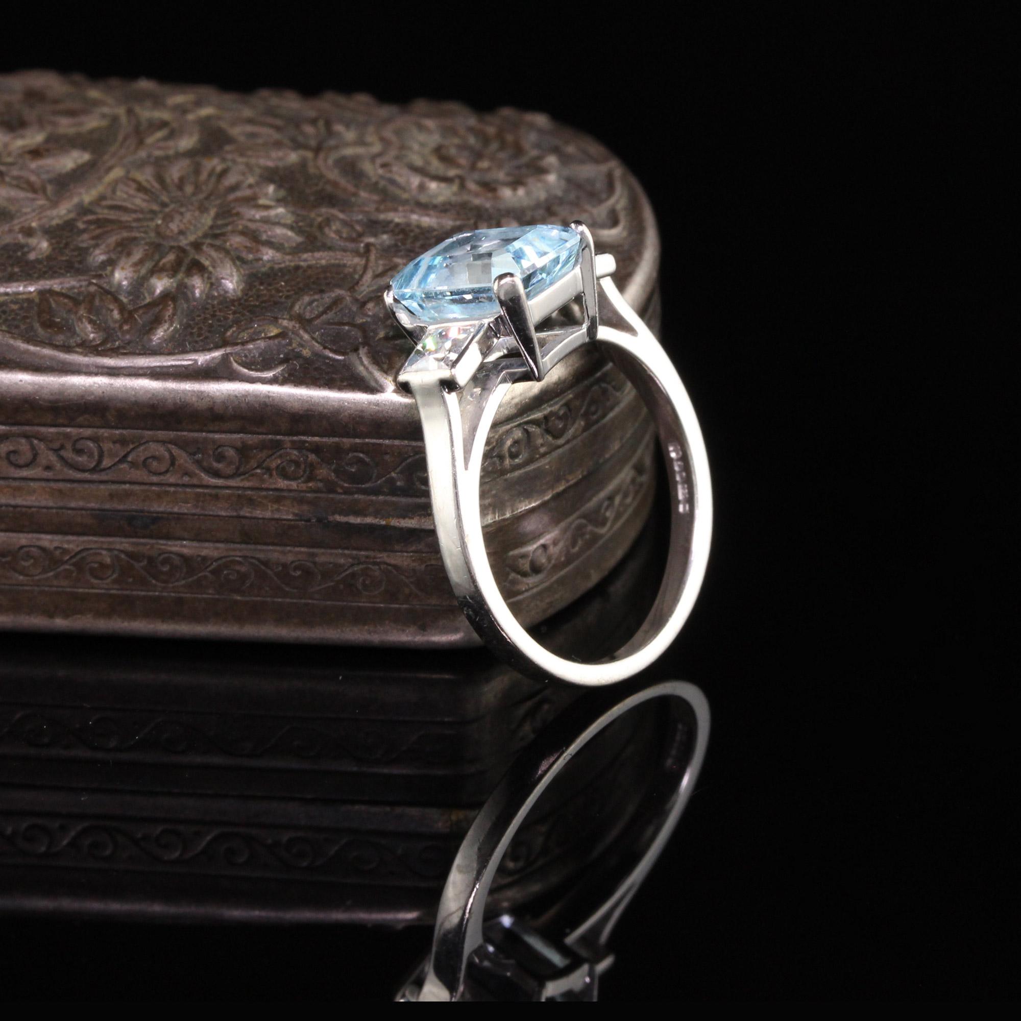 Gorgeous Antique Art Deco 18K White Gold French Cut Diamond and Aquamarine Engagement Ring. This beautiful ring features a beautiful aquamarine center with two french cut diamonds on the sides. Its a beautiful color aquamarine and very