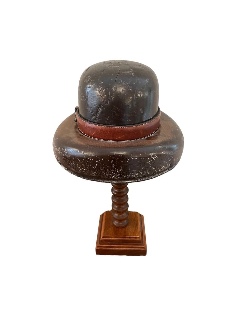 English wood hat mold on wood stand.
Men’s brimmed hat with leather and rope detail
circa 1910-1920