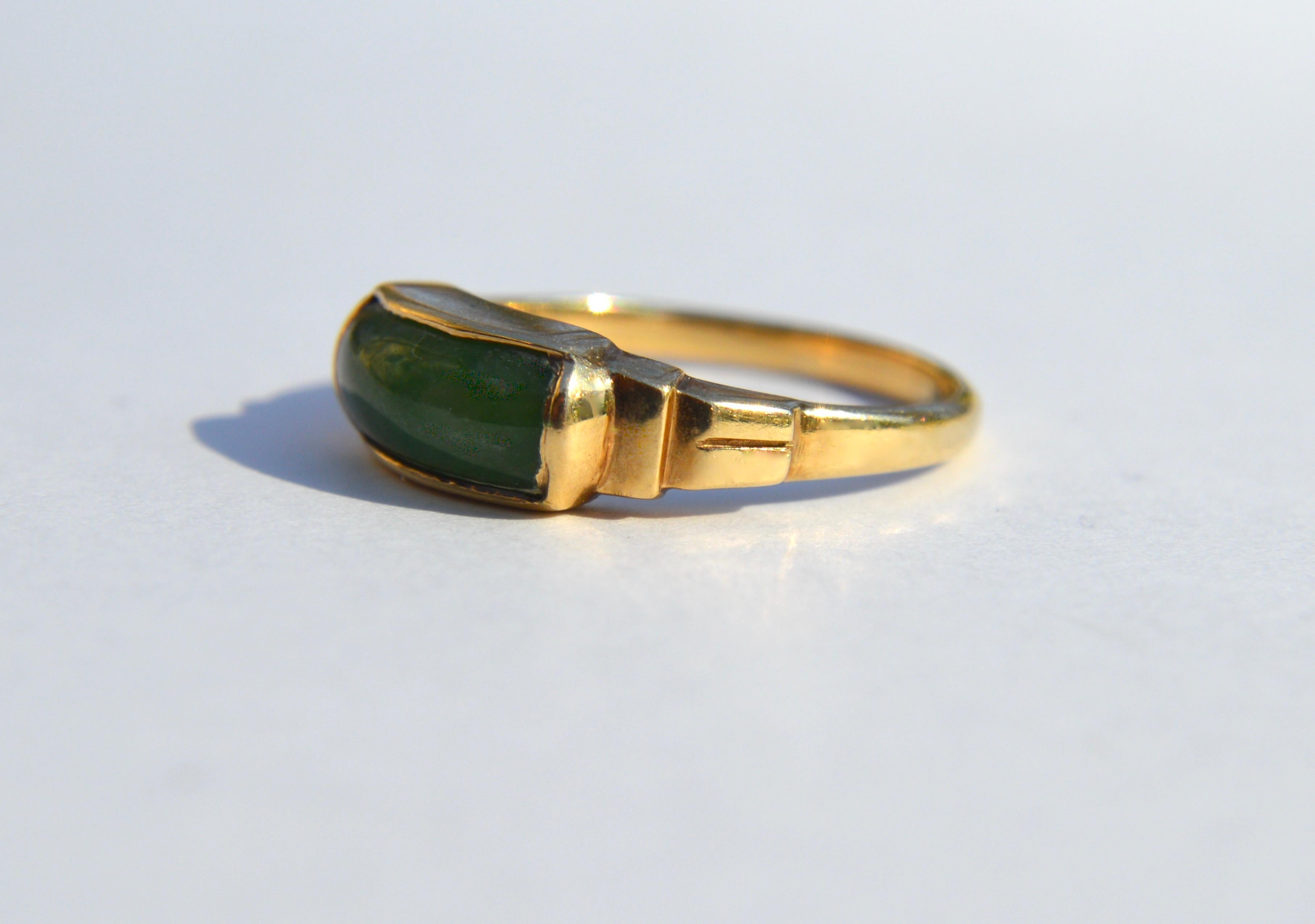 Gorgeous antique circa 1920s nephrite jade ring in solid 14K yellow gold. Size 6.25. Marked and tested as solid 14K. In very good condition. Jade measures 11x5mm. Ring weighs 2.95 grams. Perfect addition for your ring stack.

All items arrive in a
