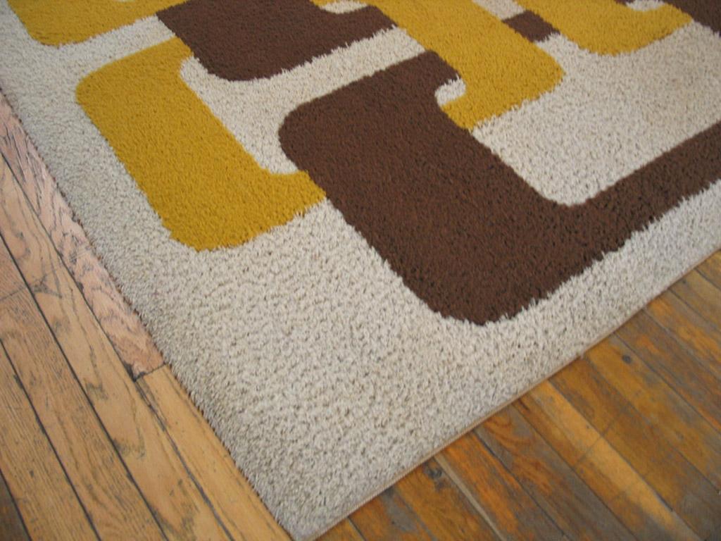 A Danish modern mod rug with bold interlinked rounded open rectangle pattern in yellow and olive on a creamy ground. No borders needed. High wooly pile. Looks like a plastic bracelet of the period. Thick pile in good condition. Unsigned or marked,