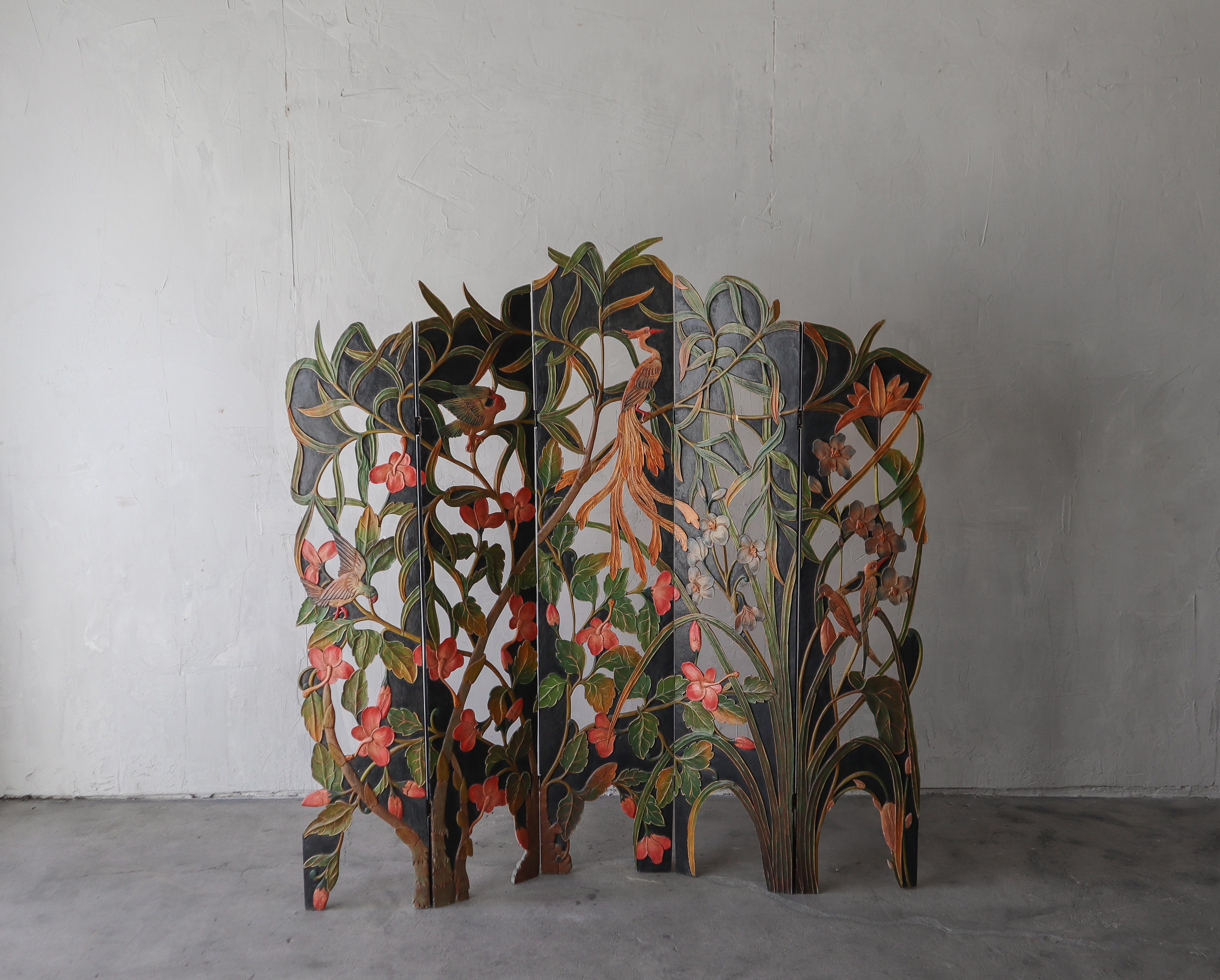 Absolutely stunning five-panel, Art Deco floral screen divider. The divider features fived tiered, hand carved and hand painted wood panels displaying gorgeous flora and fauna. The details on this thing are incredible, creating depth and texture,