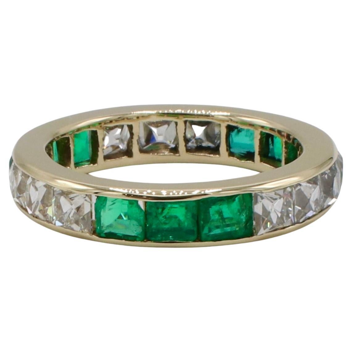 Antique Art Deco French Cut Natural Diamond & Green Emerald Eternity Band Ring 
Metal: 14k yellow gold
Diamonds: 10 french cut natural diamonds approx. 2.00 CTW F-G VS
Weight: 3.48 grams
Size: 6.5 (US)
Width: 4mm
Note: Slight gap/space between some