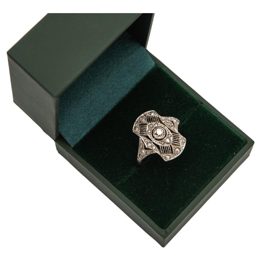 Former original Art Deco ring from around 1925.

Geometric, symmetrical shapes characteristic of the Art Deco style.

Openwork, hand-made structure made of yellow 18-carat gold with platinum elements.

Ring set with old-cut diamonds - central