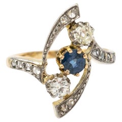 Antique Art Deco gold ring with sapphire and diamonds, circa 1910.