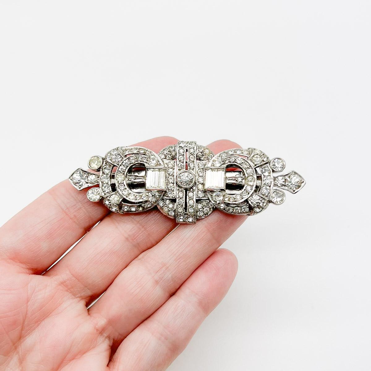 A superb Vintage Art Deco double dress clip. A stunning and rare example of a large art deco, paste set double dress clip, crafted in sterling silver - a weighty and high quality find. A transformative piece of jewellery to adorn in multiple ways