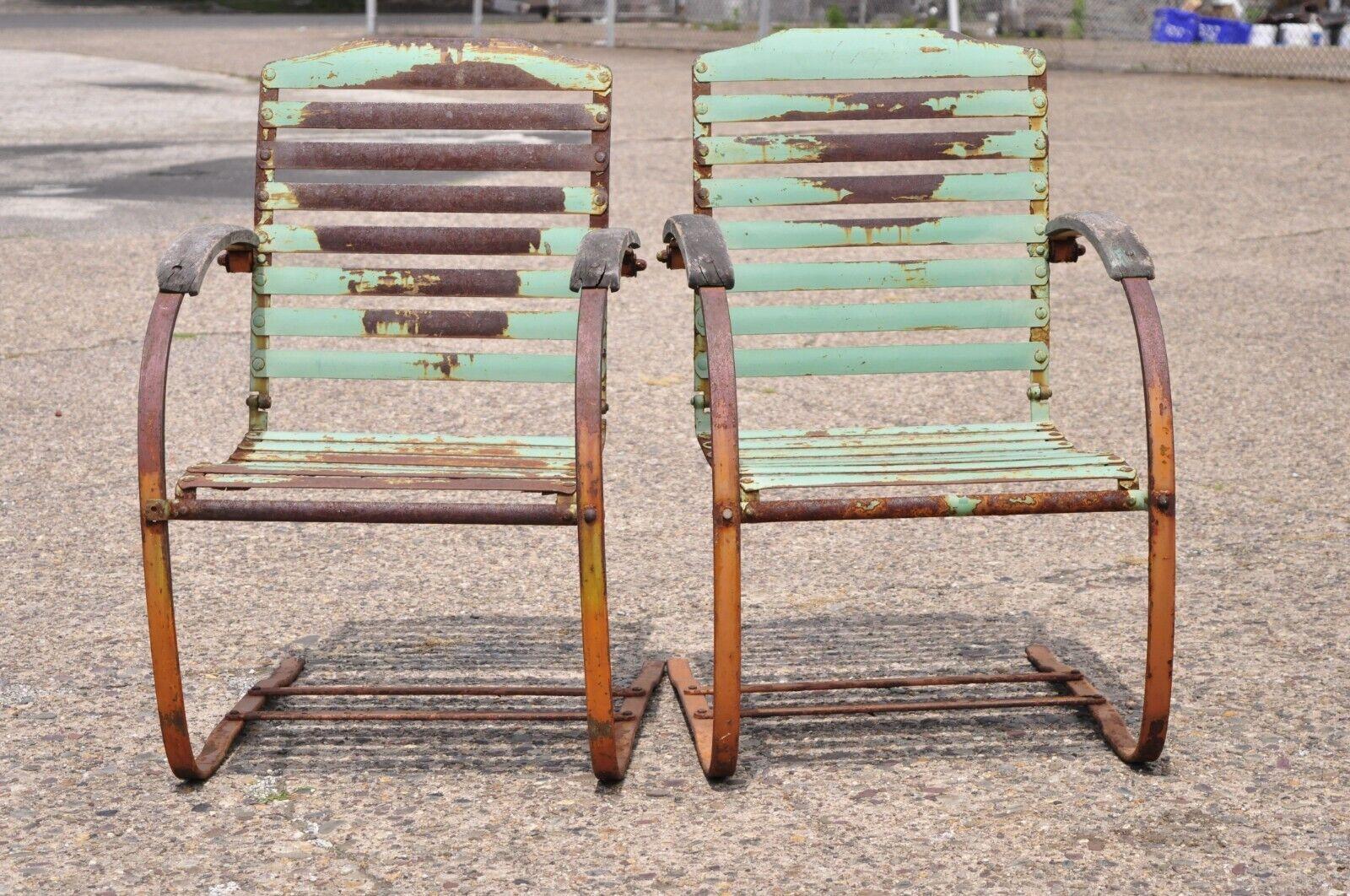 Antique Art Deco green distress painted steel metal outdoor lounge chairs - a pair. item features iron/steel metal bouncer frames, iron slats, wooden armrests, distressed green painted weathered finish, very nice antique pair, great style and form.