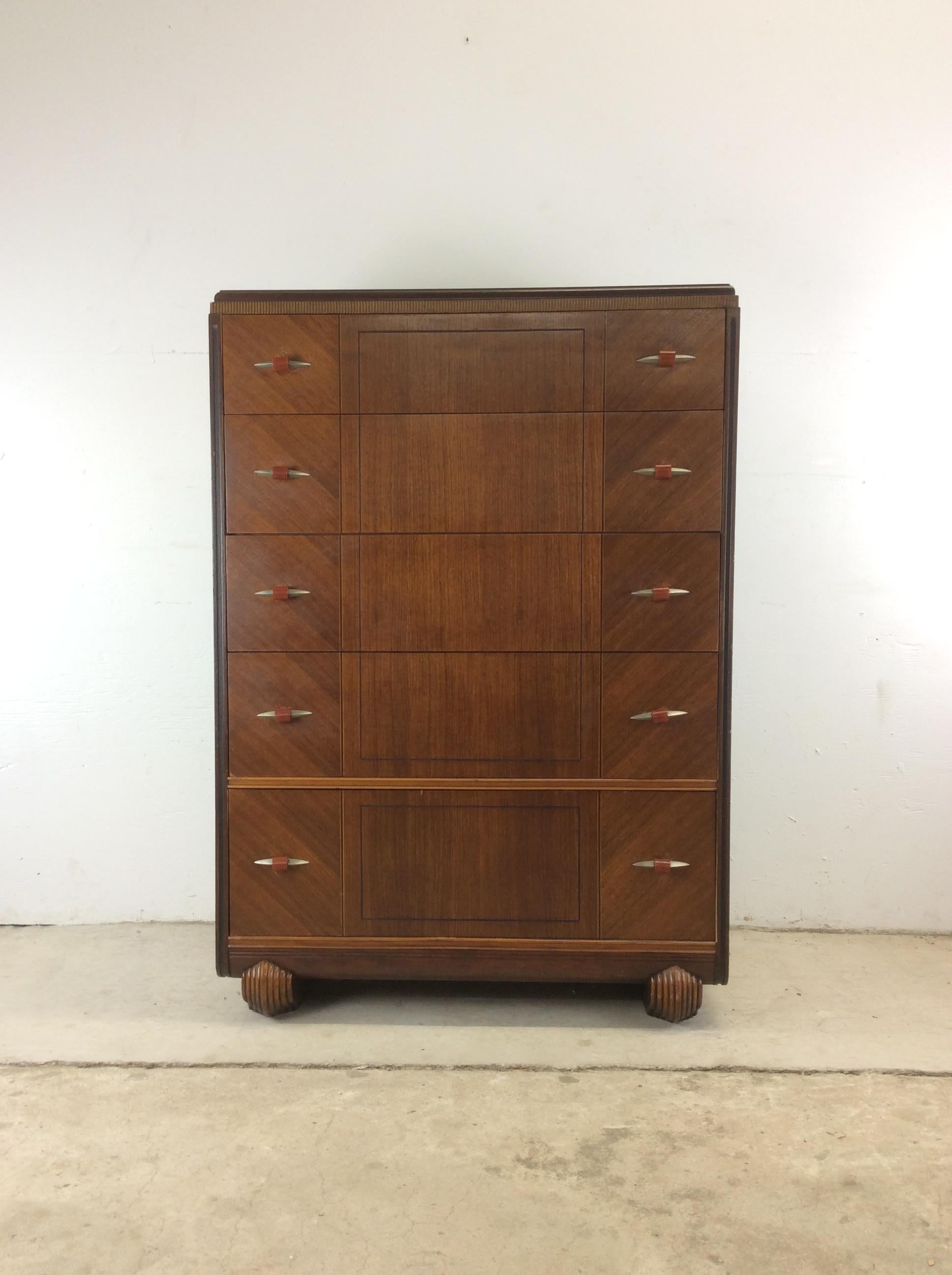 This antique Art Deco style highboy features original walnut finish with unique wood grain, detailed trim along the top edges, chrome hardware with bakelite, and unique carved feet.

Matching mirrored vanity, chest of drawers with mirror and single