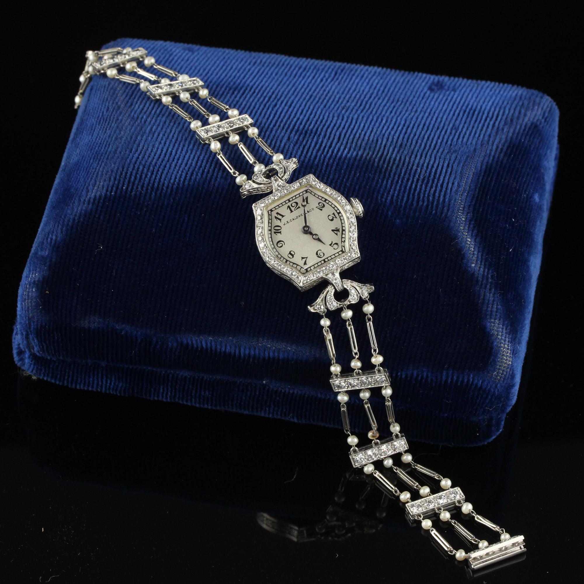 Beautiful Antique Art Deco J. E. Caldwell Old Euro Diamond and Pearl Evening Watch. This gorgeous J.E. Caldwell watch is crafted in platinum. This gorgeous watch has old European cut diamonds set in each station and has natural pearls set throughout