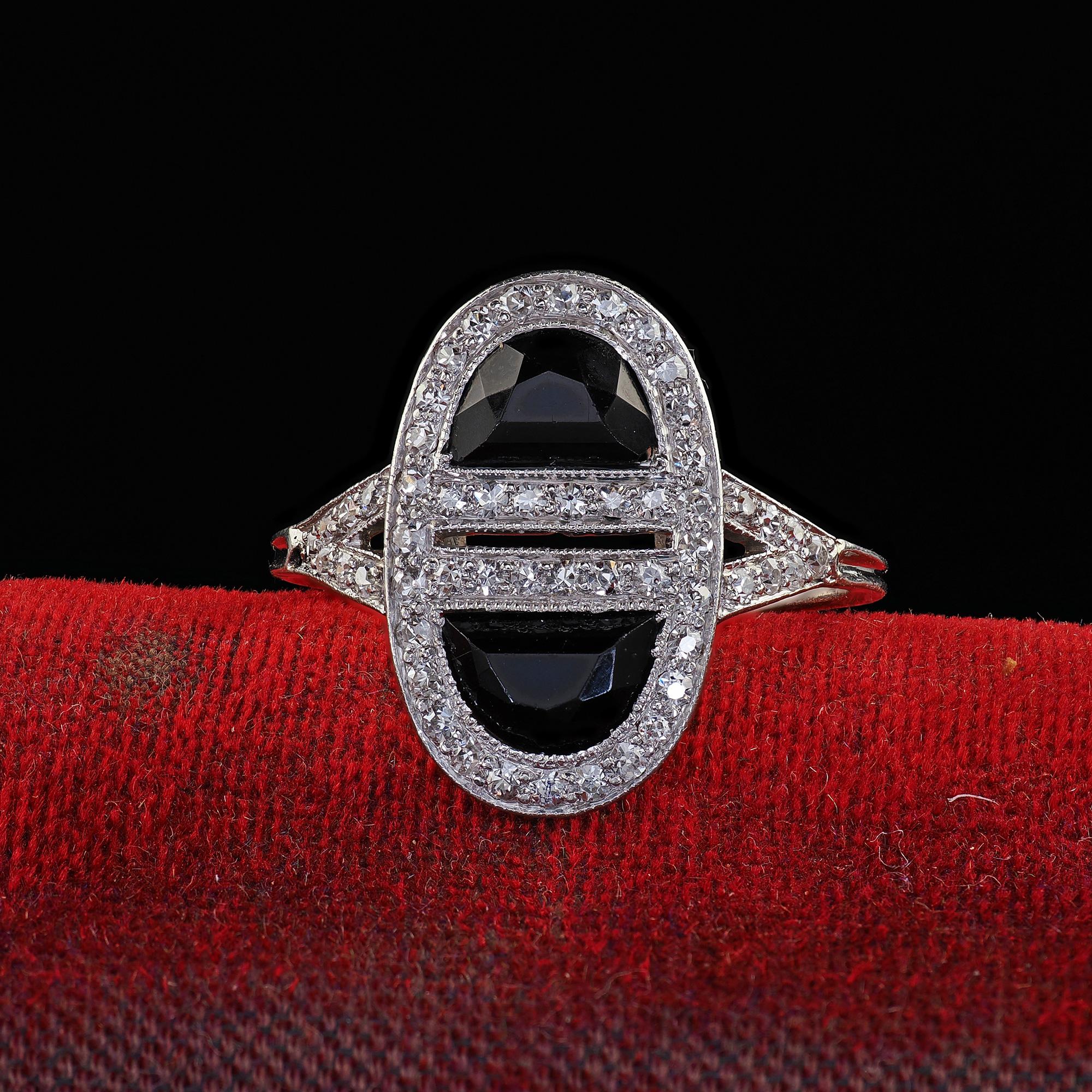 Beautiful Antique Art Deco J. E. Caldwell Platinum French Cut Onyx and Diamond Ring. This beautiful Art Deco J. E. Caldwell French cut onyx and diamond ring is crafted in platinum. The ring features two gorgeous French cut half moon onyx surrounded