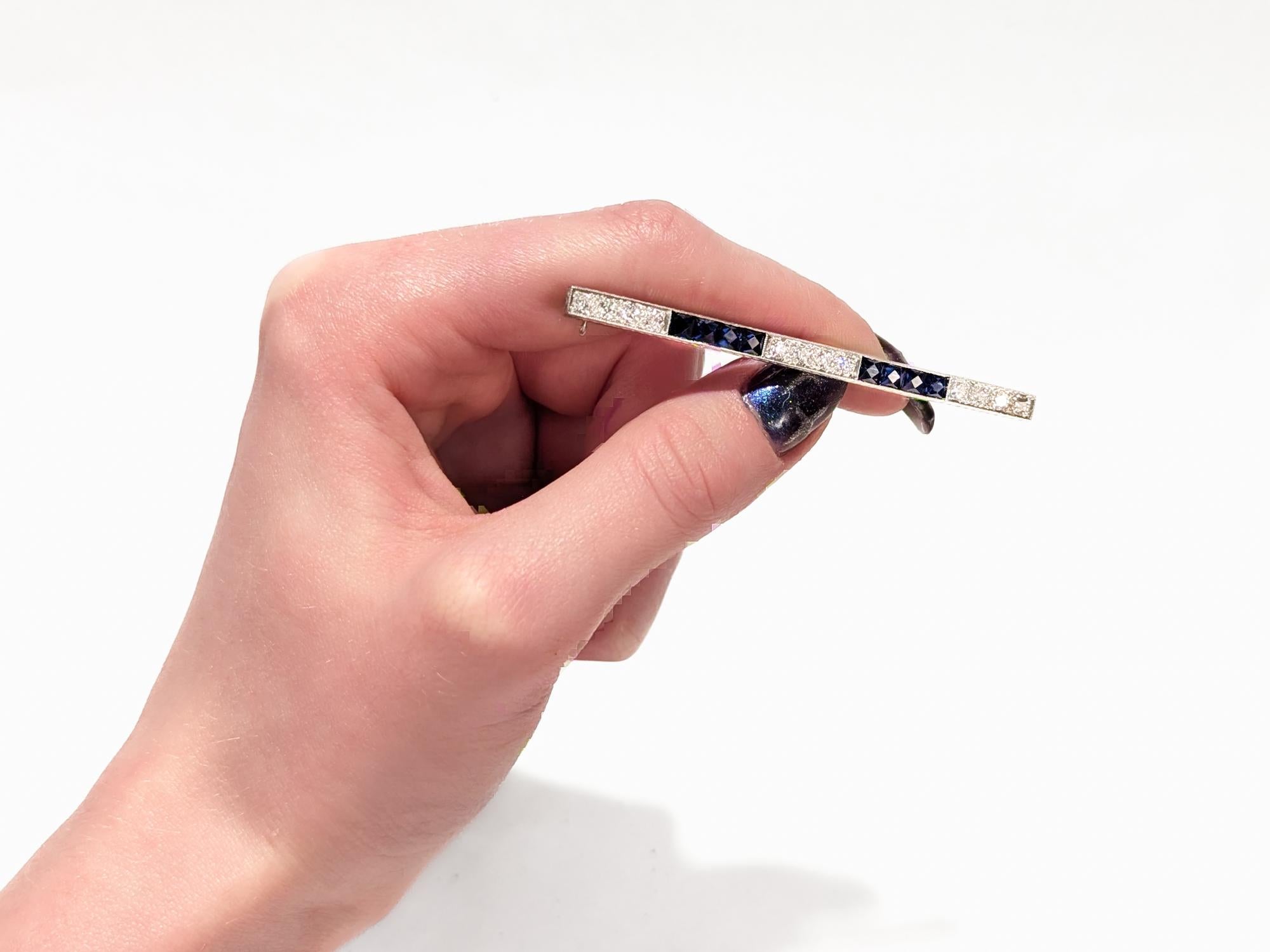 Antique Art Deco J.E. Caldwell Platinum, Diamond, & Sapphire Bar Brooch In Good Condition For Sale In Philadelphia, PA