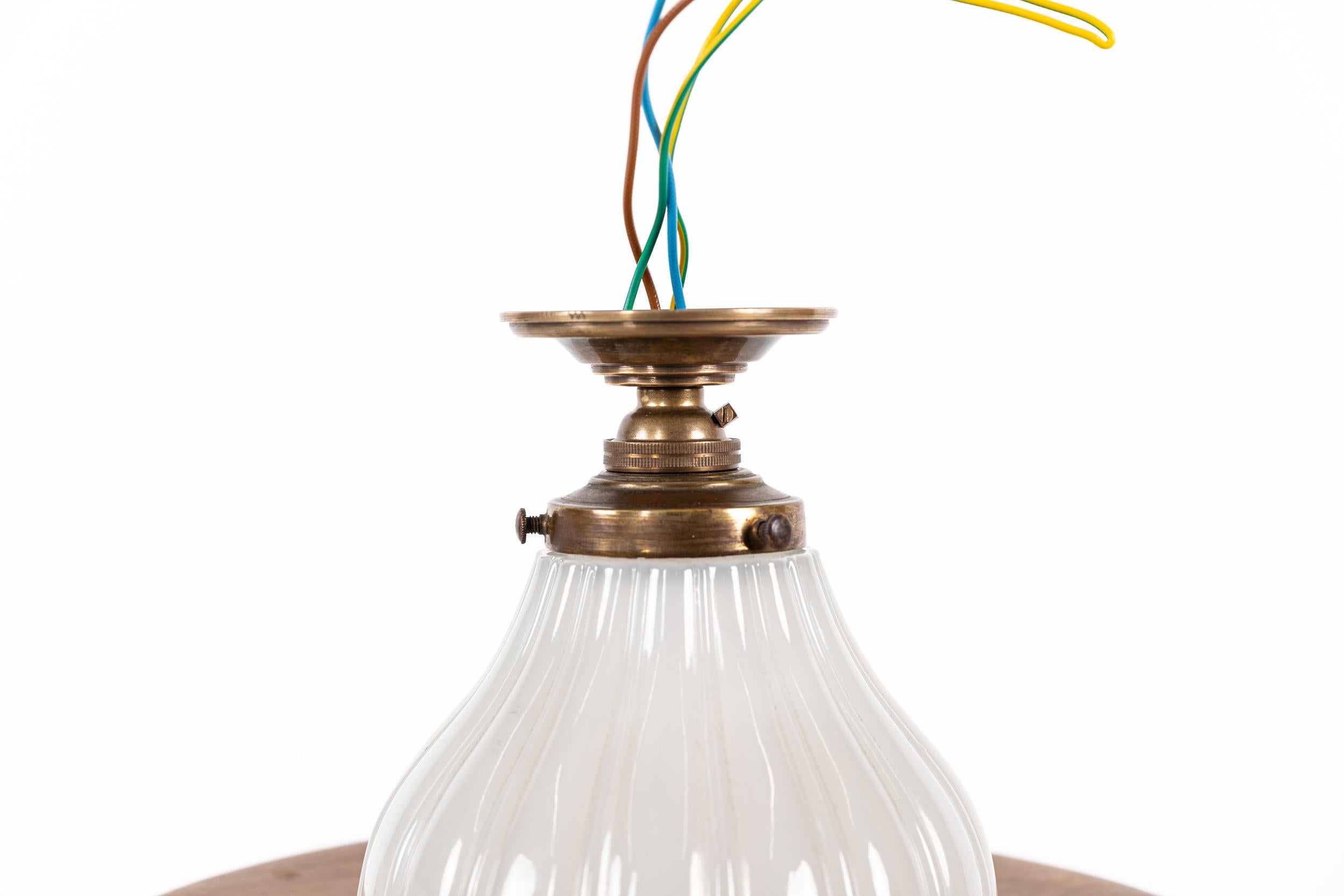An elegantly formed ceiling lamp with heavy duty Jefferson Moonstone glass shade. c.1920

Excellent quality with thick pressed opaque fluted glass shades and heavy duty brass gallery and ceiling mount.