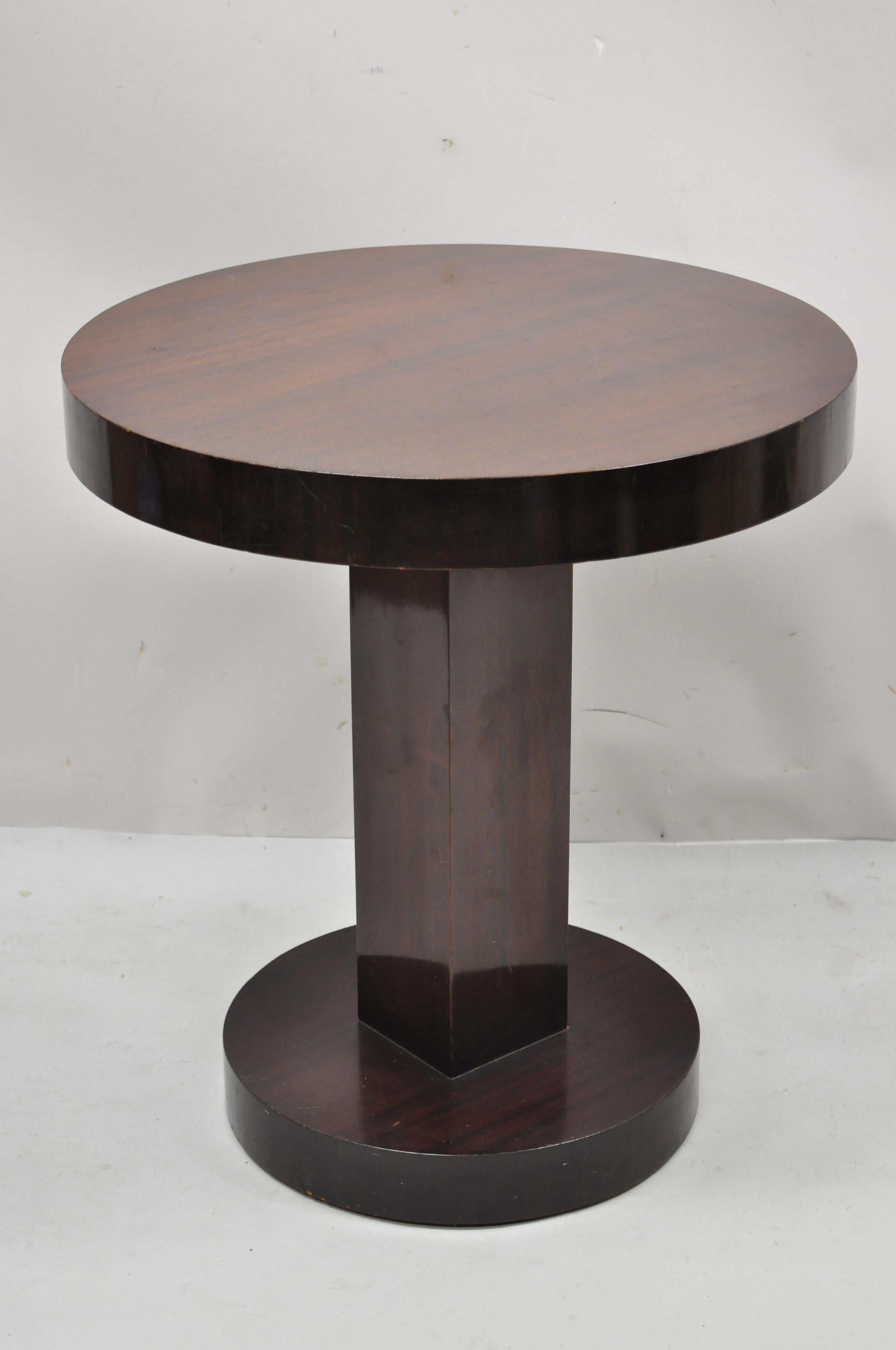 Antique Art Deco mahogany round pedestal base accent center plant stand table. Item features square column support, round top, round base, beautiful wood grain, very nice vintage item, great style and form, Circa mid 20th century. Measurements: