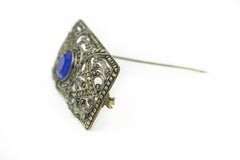 Antique Art Deco Marcasite Silver Openwork Brooch with Blue Center Stone