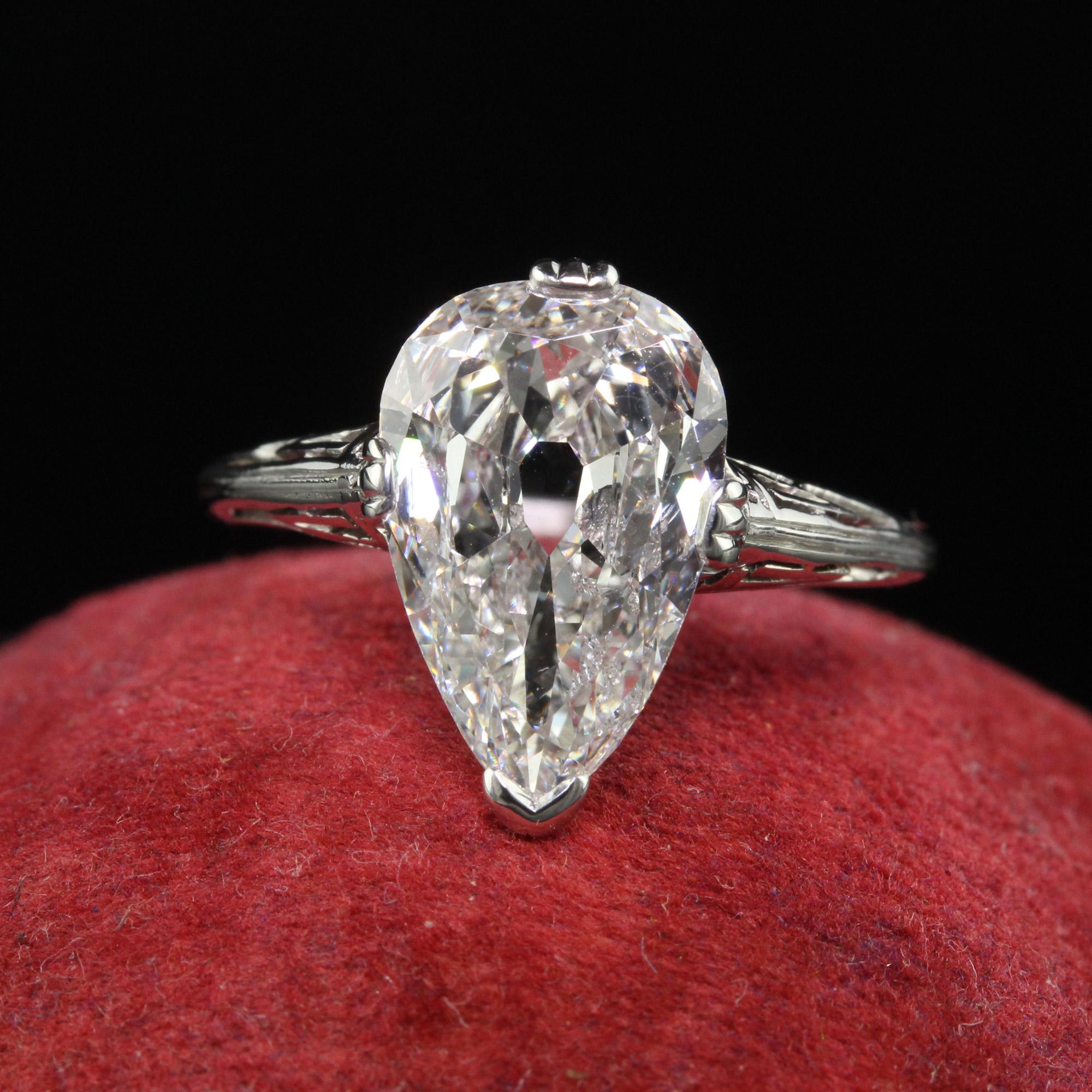 Beautiful Antique Art Deco Marcus and Co Platinum Old Pear Diamond Engagement Ring - GIA. This incredible antique Marcus and Co engagement ring is crafted in platinum. The center holds a gorgeous old pear shape diamond that looks larger than it is