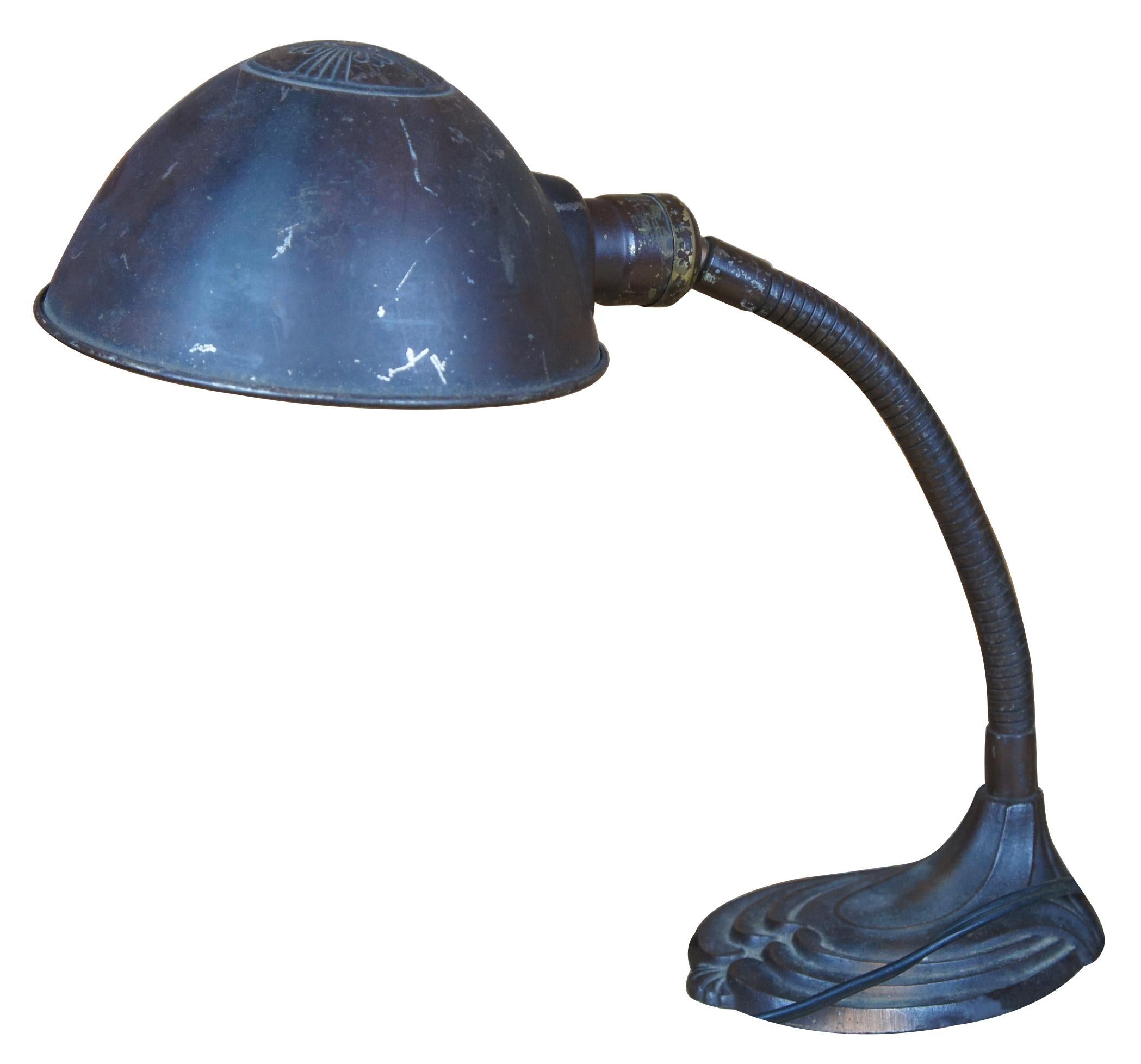 Antique Art Deco desk or table lamp featuring articulating gooseneck and iron base.
 