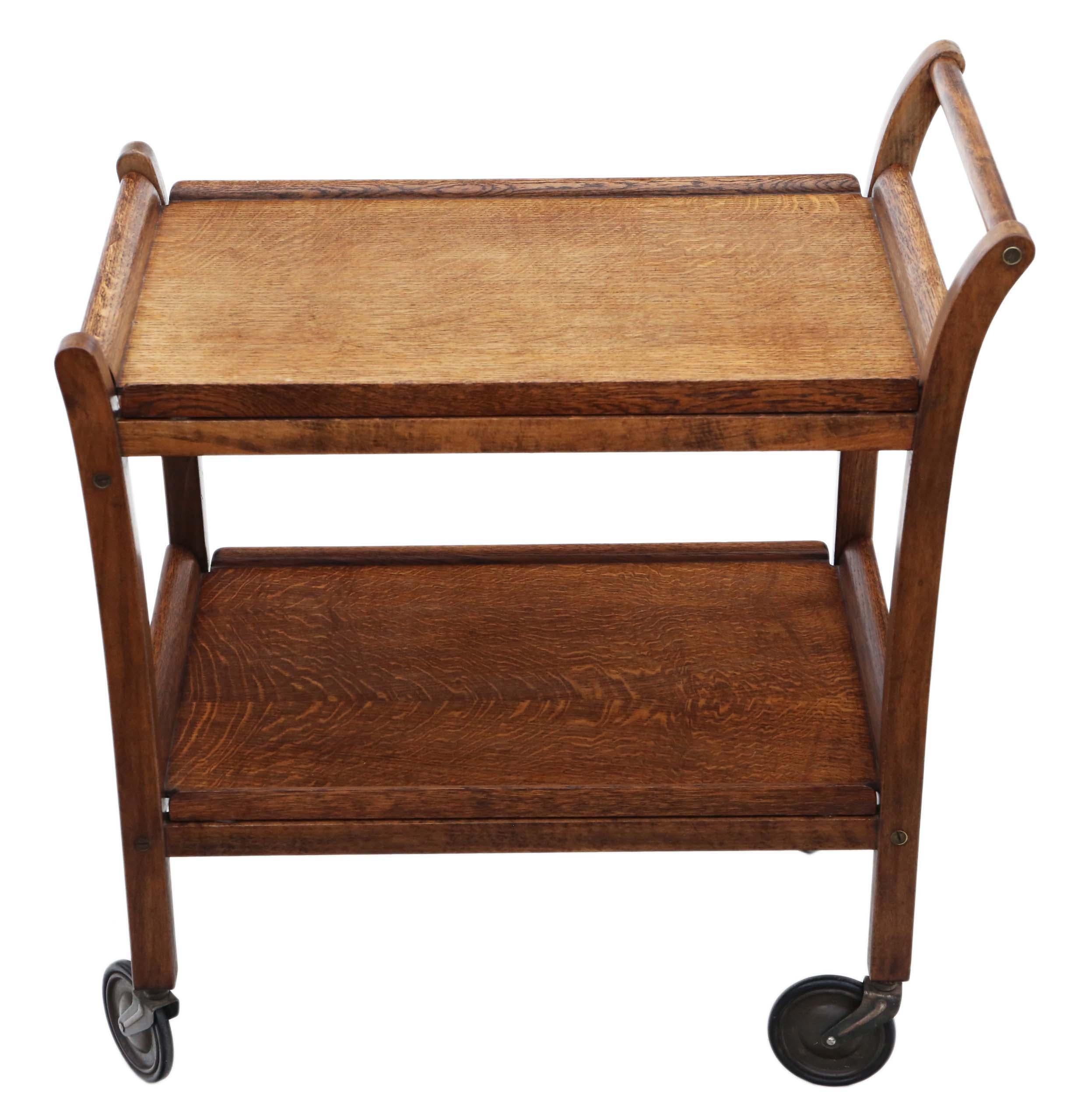 Antique Art Deco oak cake drinks serving table or trolley C1930.

A beautiful piece that shouts retro style. Two lift out serving trays.

Would look amazing in the right location!

Overall maximum dimensions: 70cm L x 42cm W x 75cm H. Trays