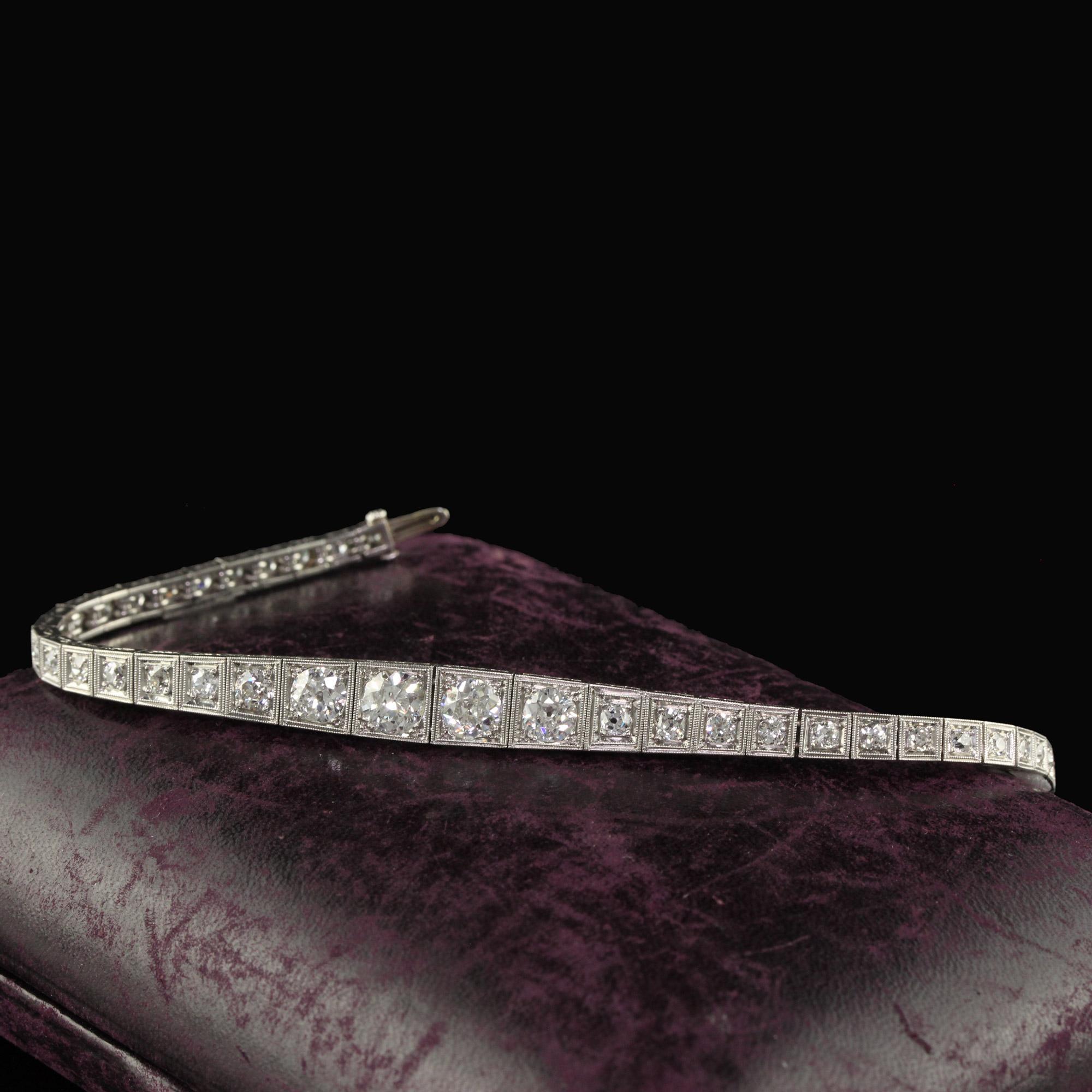 Beautiful Antique Art Deco Old European Cut Diamond Graduated Line Bracelet. This gorgeous Art Deco old European diamond bracelet is crafted in platinum. The bracelet features old European cut diamonds set in a graduated Art Deco mounting that is in