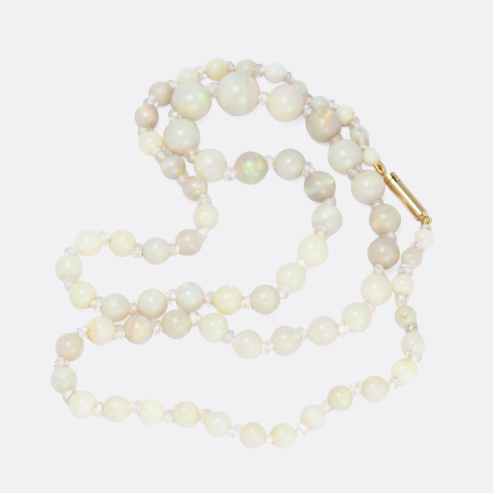 A gorgeous string of opal beads dating from the Art Deco period, circa 1920. The stones are graduated towards the middle, and display excellent flash and colour; they're strung with rock crystal dividers.

STONES 
Opal & Rock Crystal

MEASUREMENTS